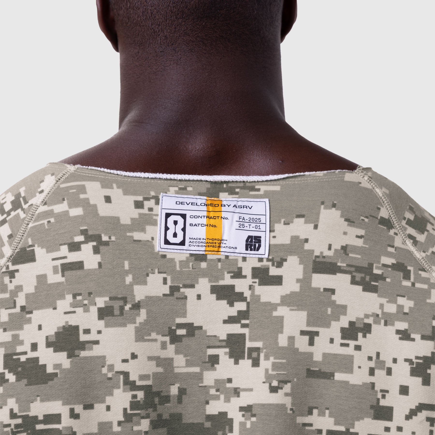 Digital camo vintage raw hem pump cover worn by model, back view showing pixelated tan and grey pattern