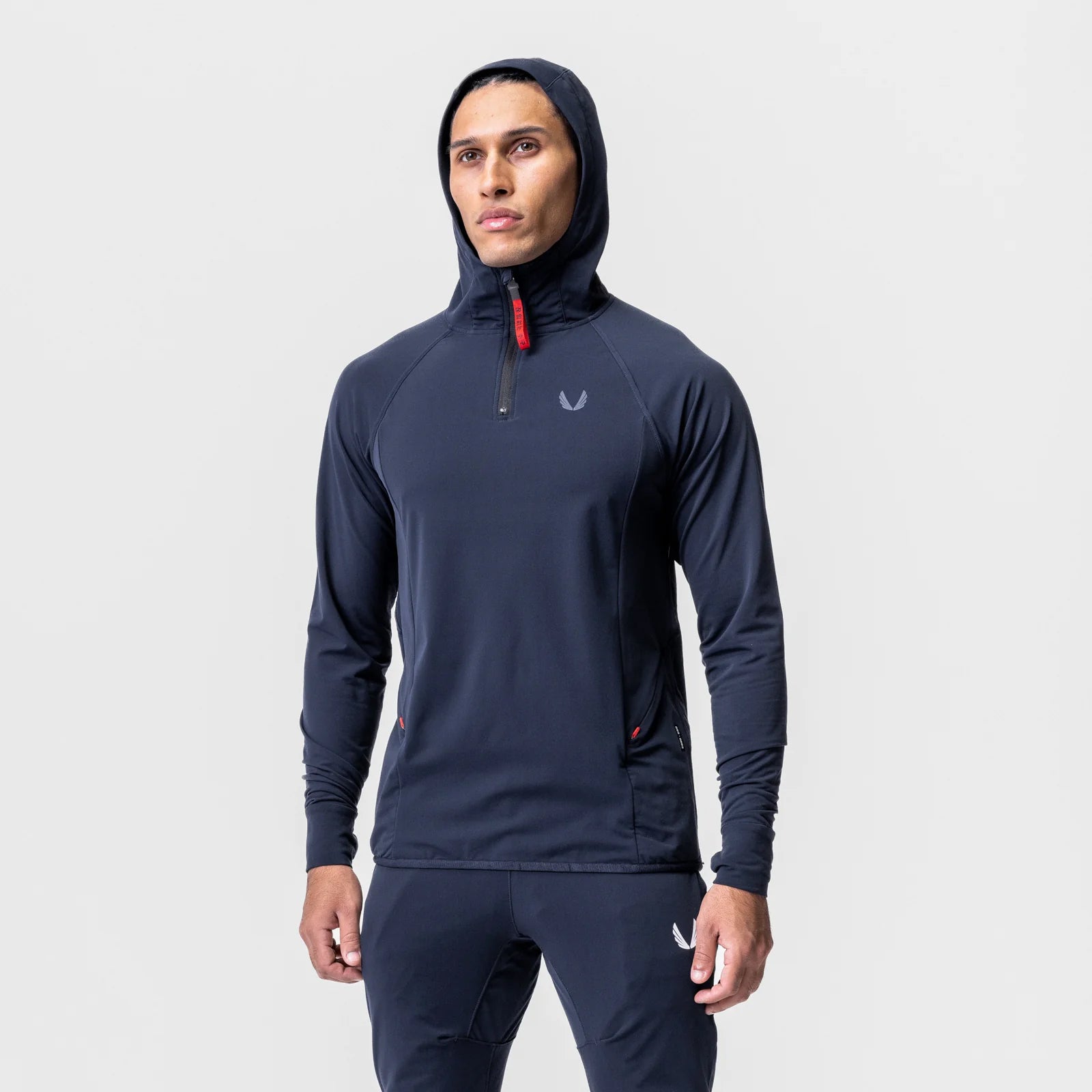 Navy training hoodie with hood up on model, front view