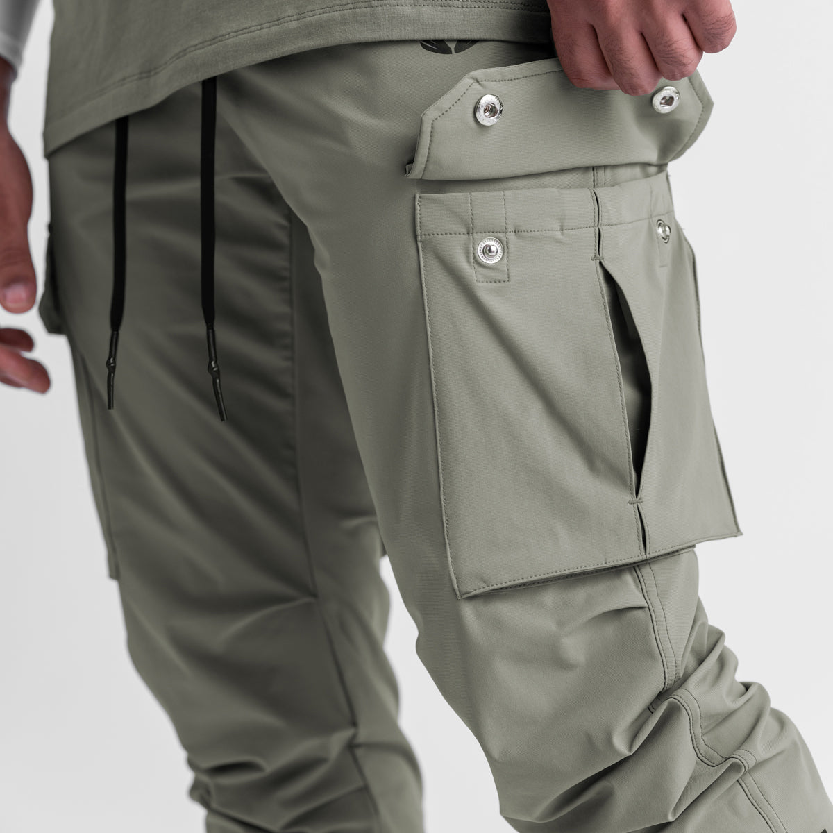Tetra-Lite Cargo High Rib Jogger in sage worn by model, side detail view