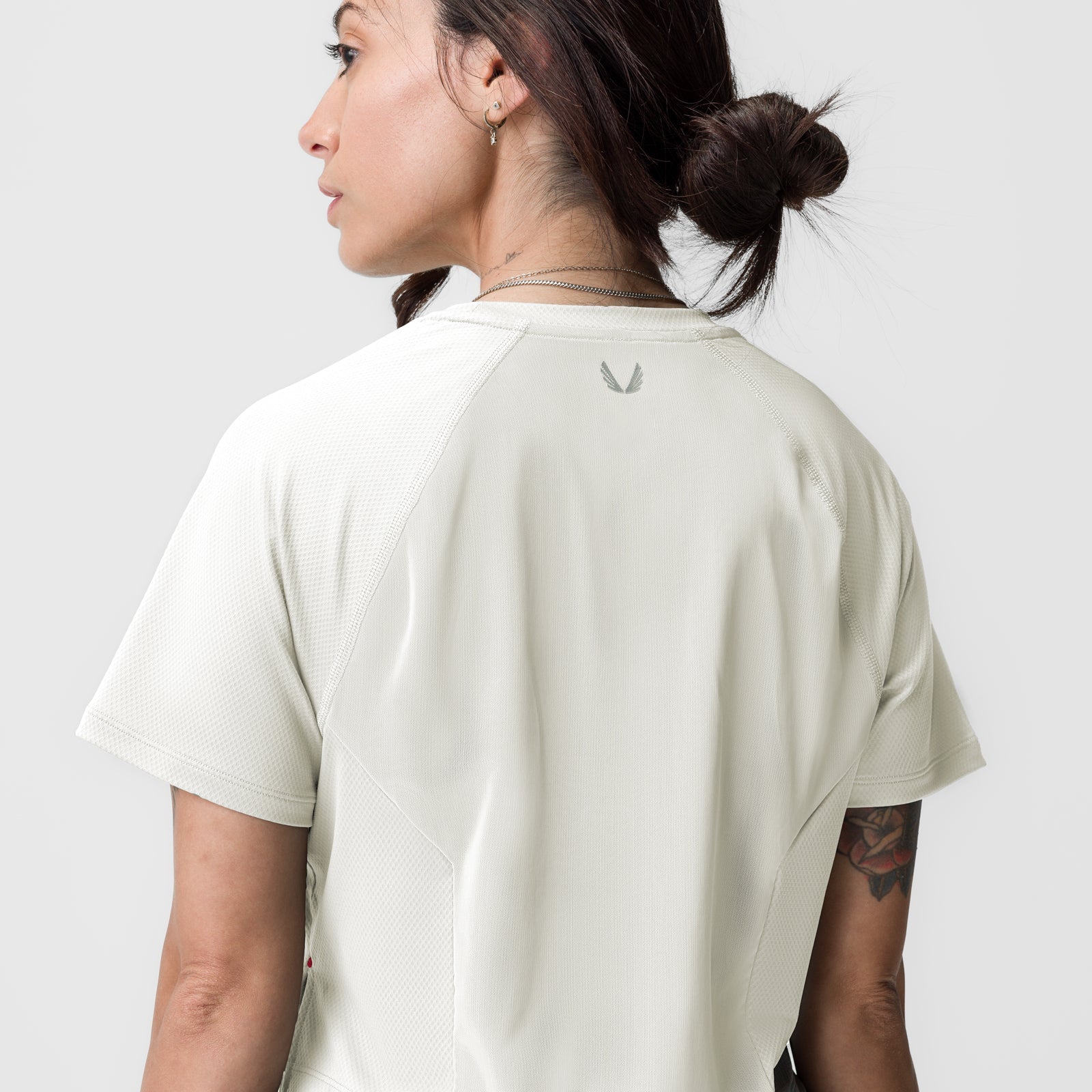 ASRV AeroSilver cropped training tee in ivory cream, worn by model shown from back