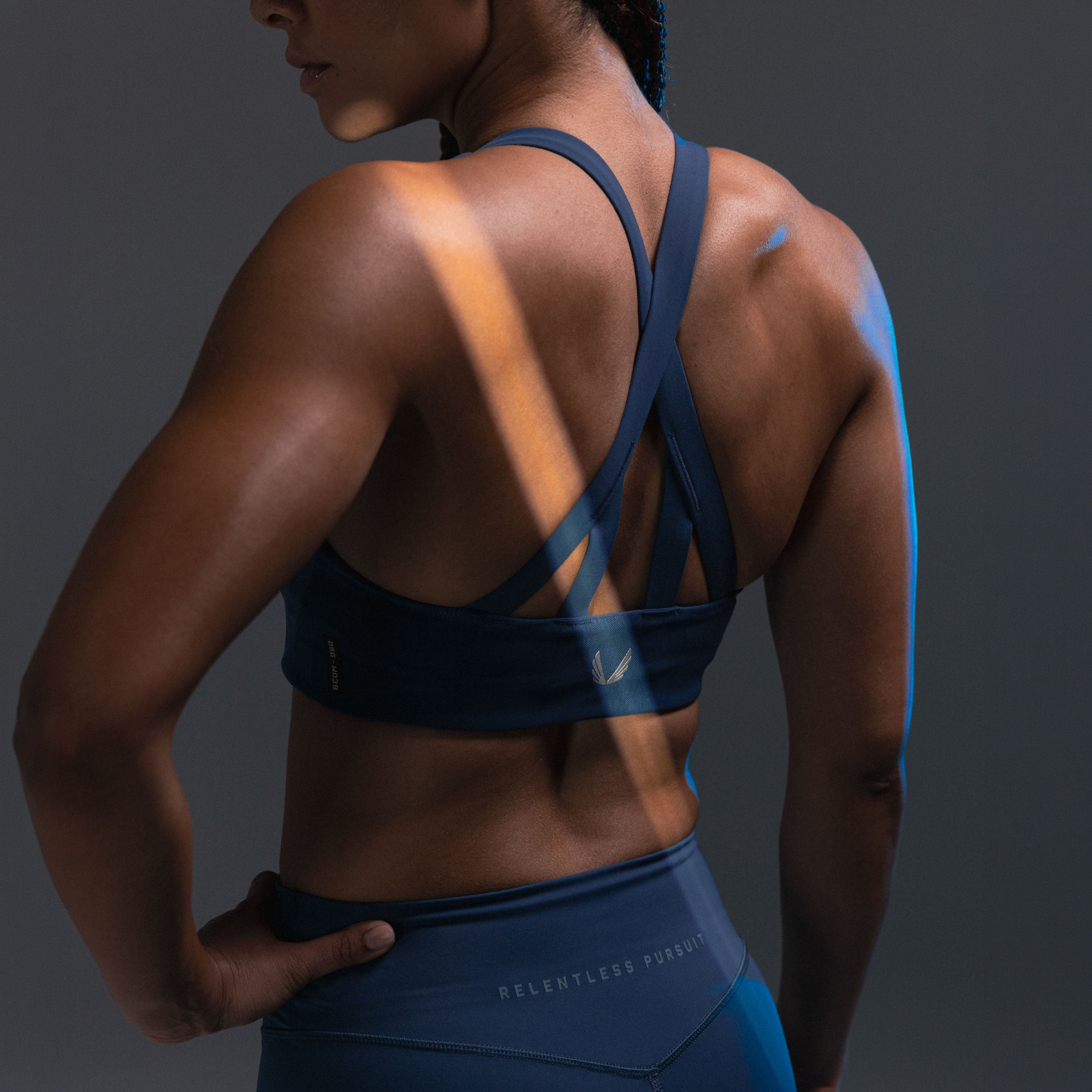 LYCRA® Hybrid Sports Bra in Storm blue, back view on model