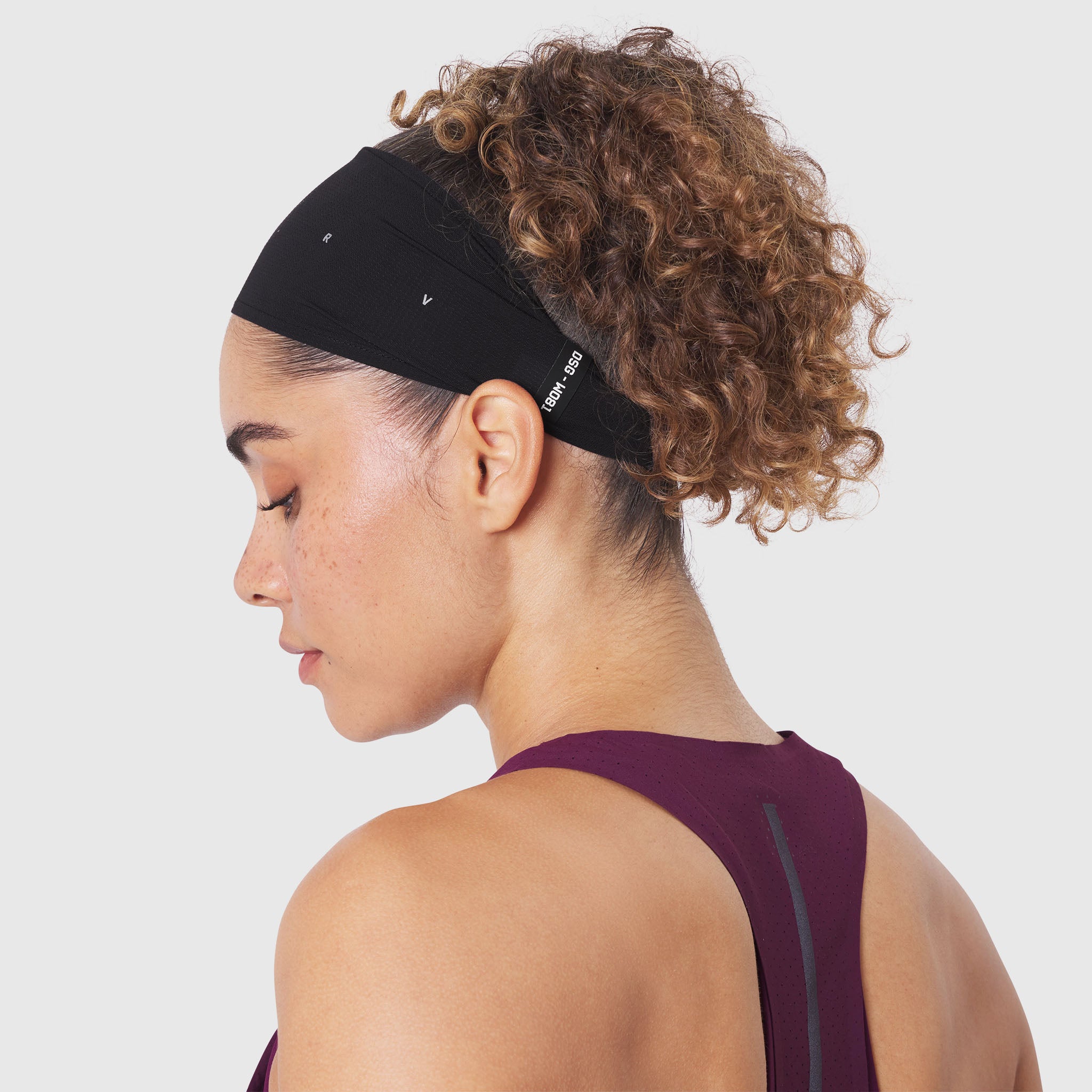 Ice-Skin™ Performance Headband in black, worn by model from side profile view