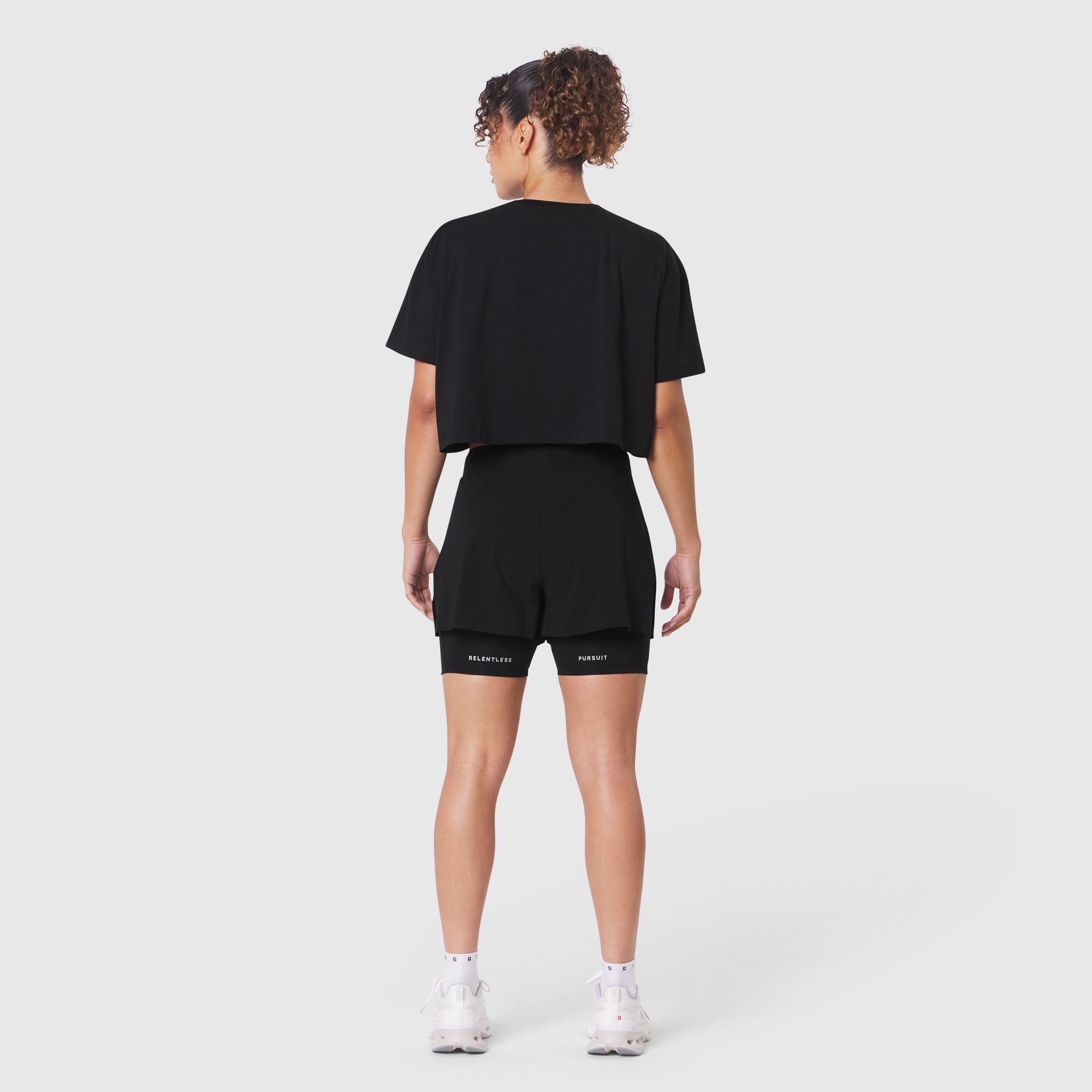 W082 Supima Ice-Skin Reversible Crop Tee in black, back view on model