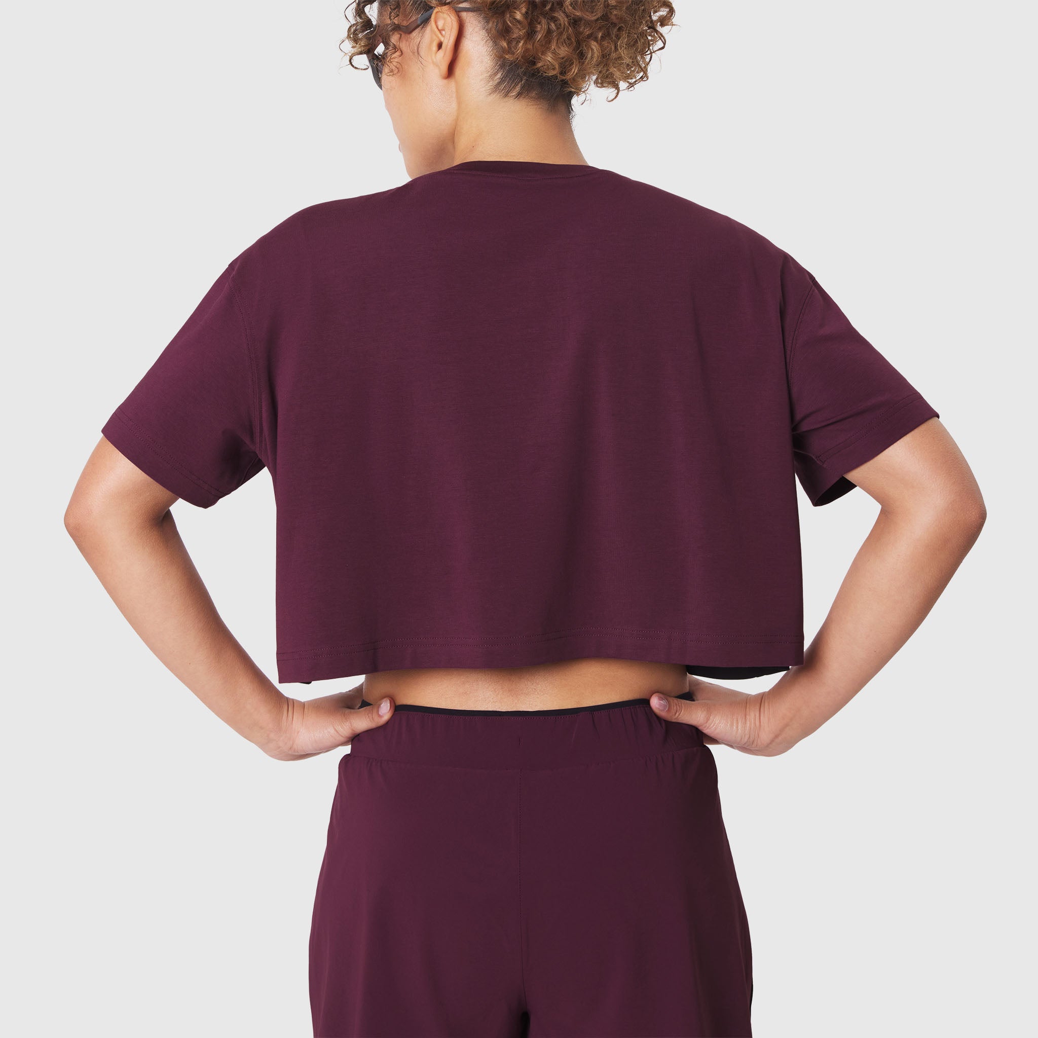 W082 Supima Ice-Skin Reversible Crop Tee in Merlot, back view on model