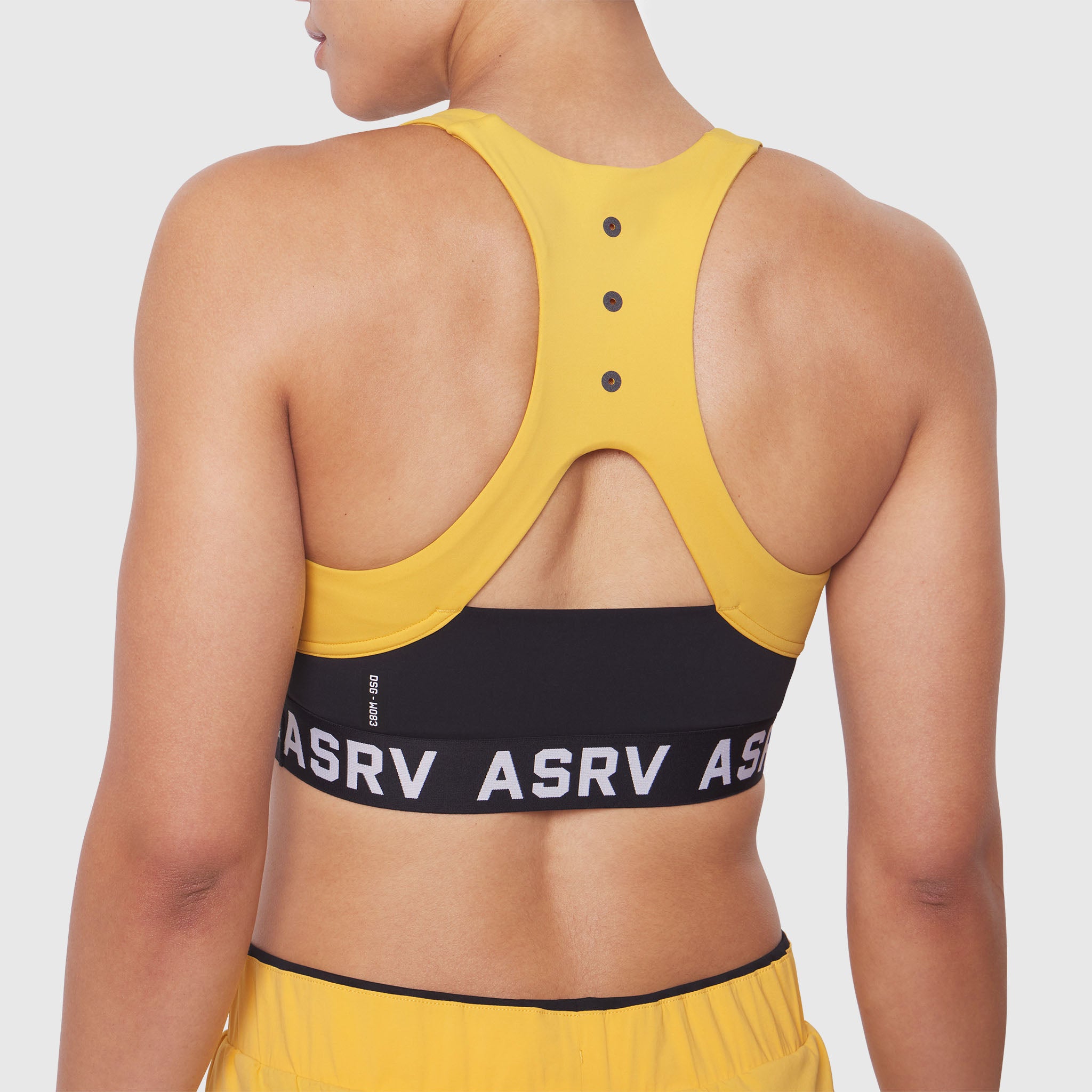 W083 LYCRA® ADAPTIV Racerback Sports Bra in Amber, back view on model