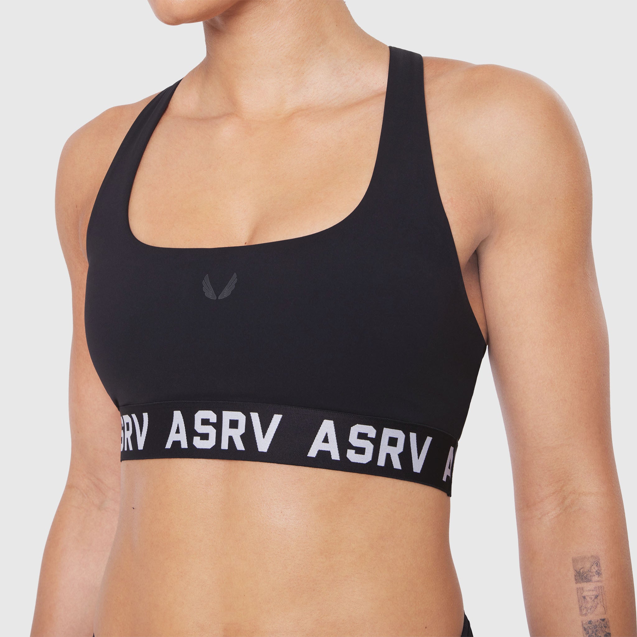 W083 LYCRA® ADAPTIV Racerback Sports Bra in black, front view on model