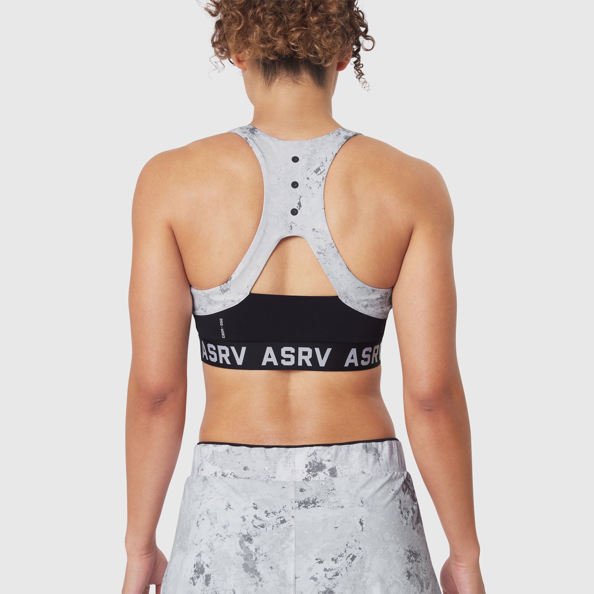 W083 LYCRA® ADAPTIV Racerback Sports Bra in Sedona Snow Camo, back view on model