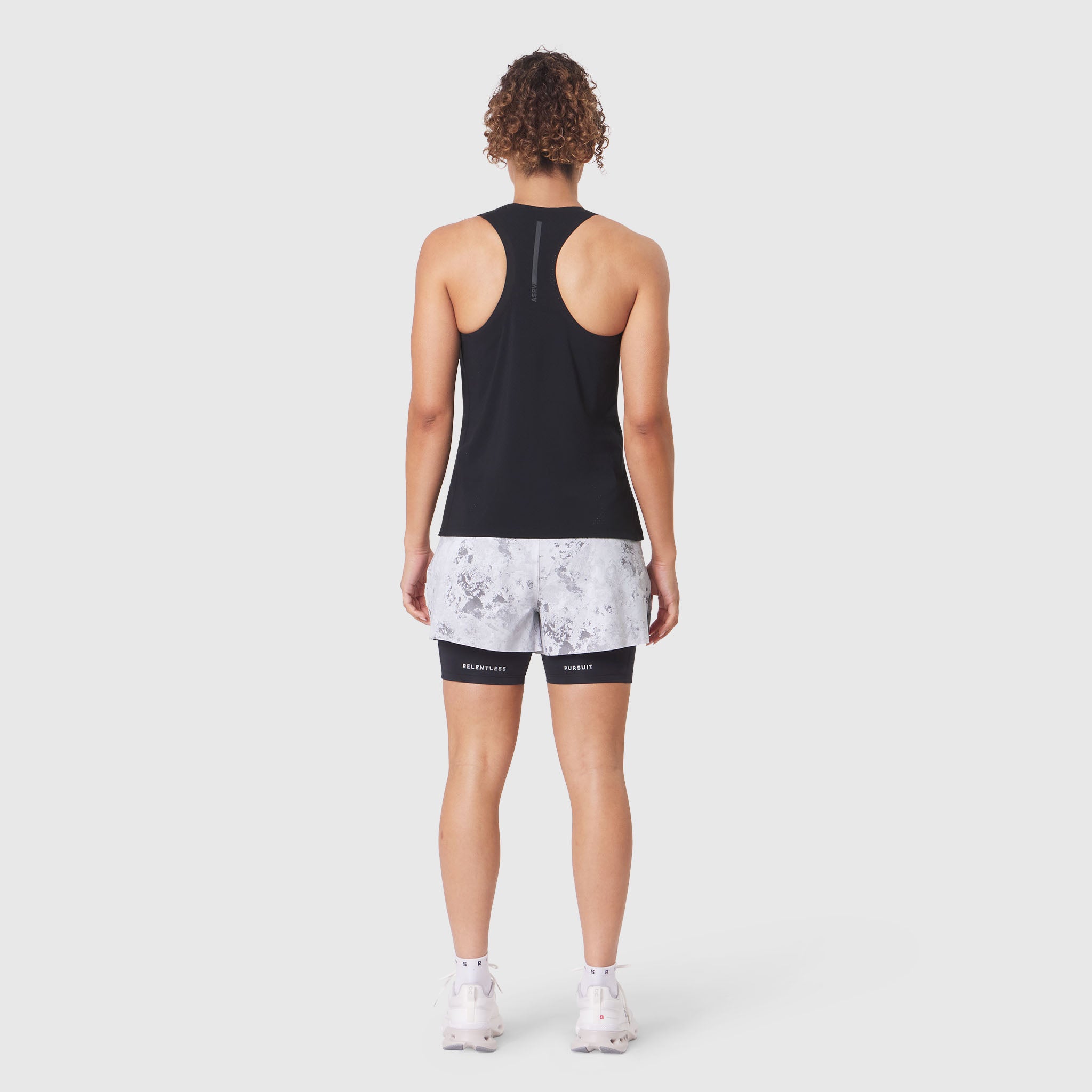 Aerotex Perforated Run Tank in black, back view on model