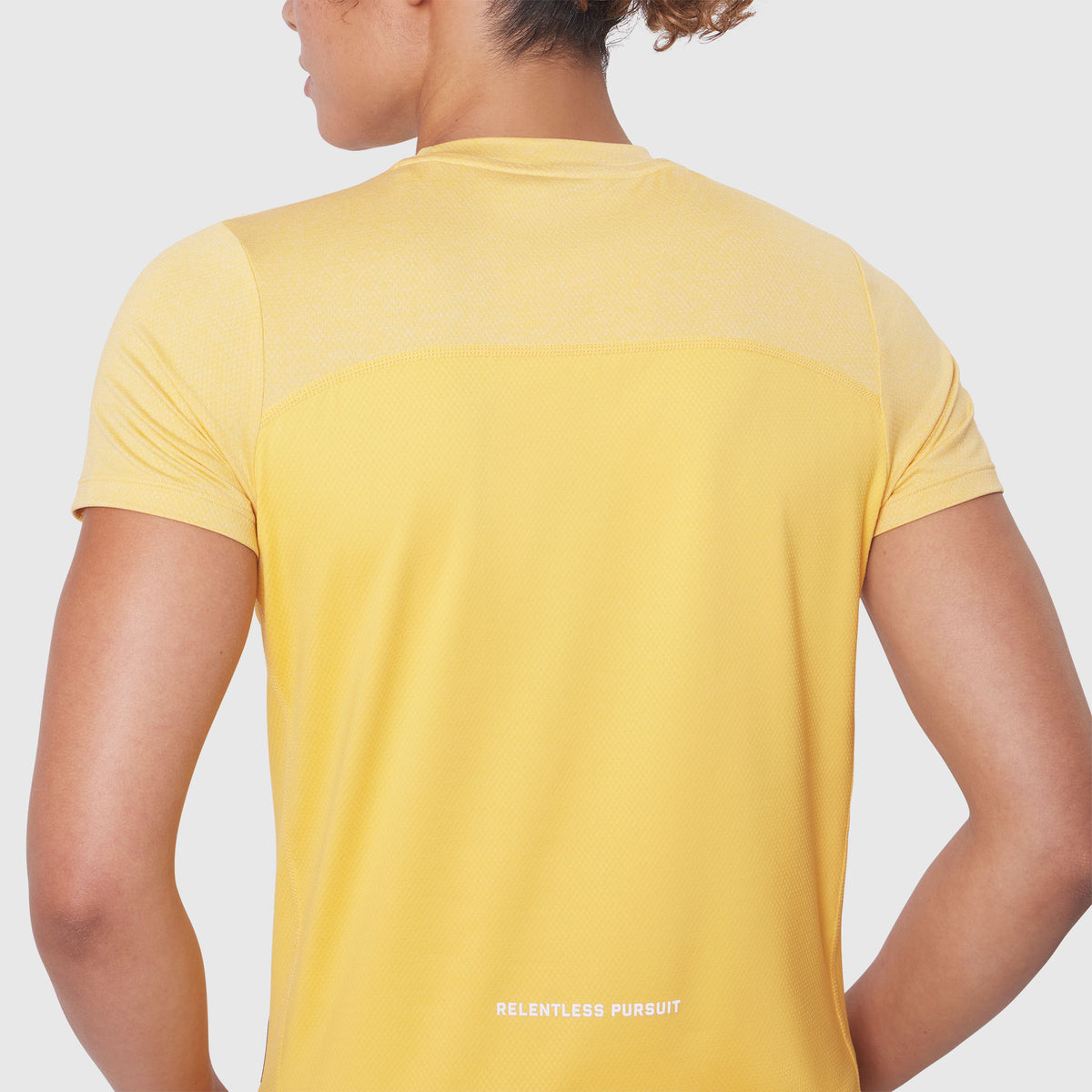 AEROSILVER® UPF50+ Run Tee in Amber, back view on model