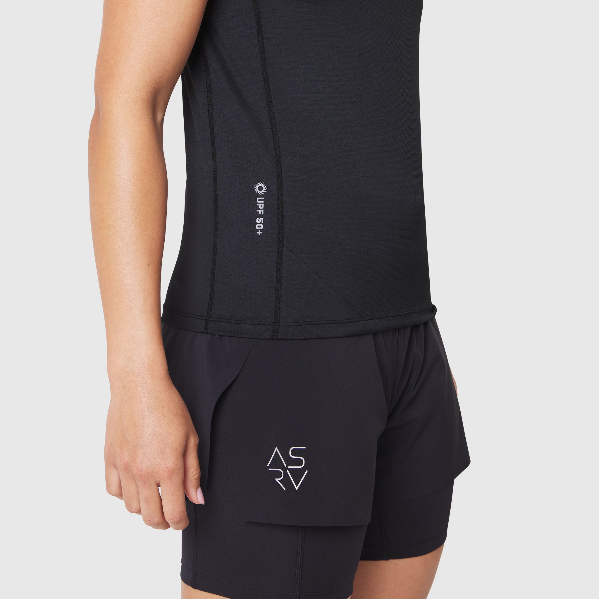 AEROSILVER® UPF50+ Run Tee in black, worn by model, side view