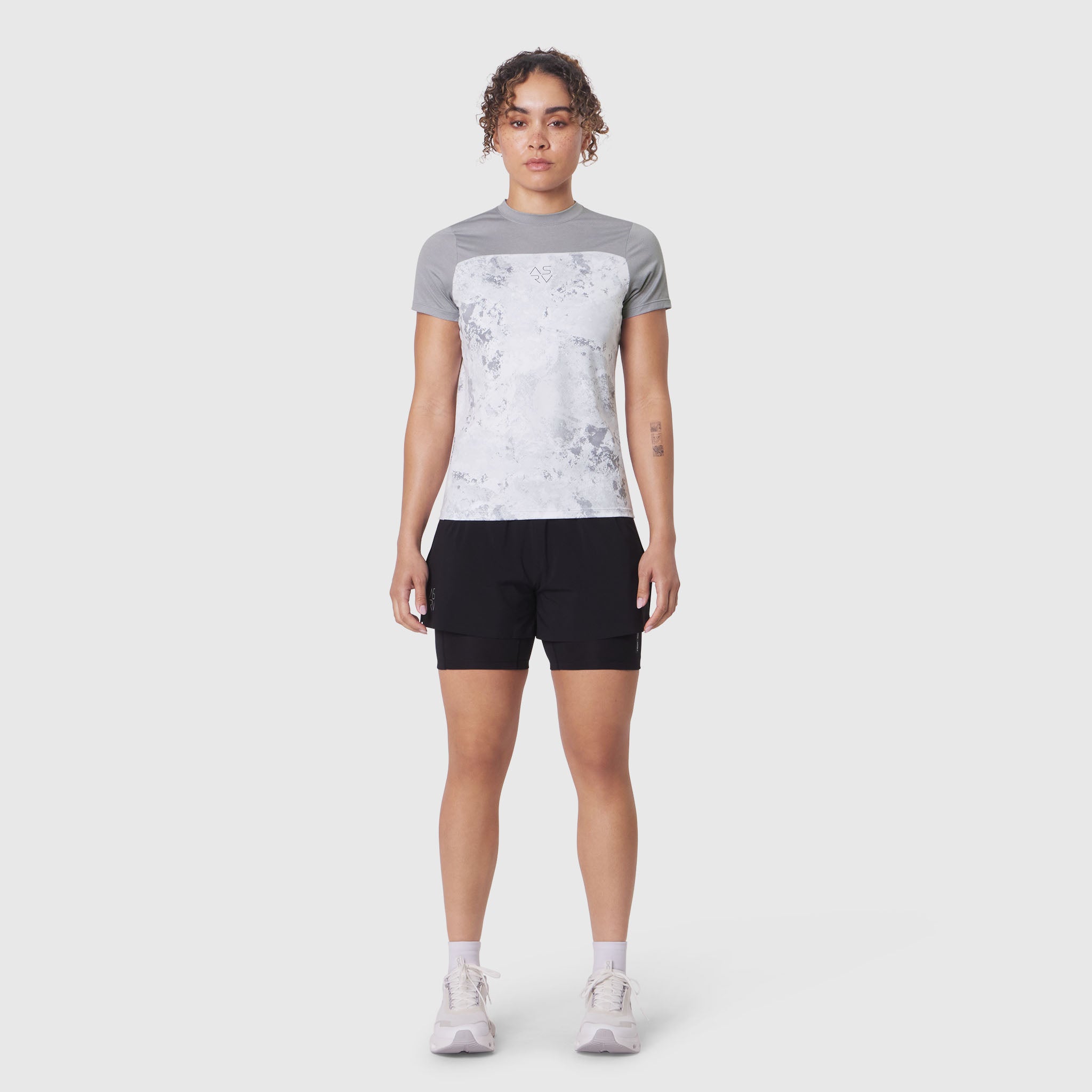 W086 AEROSILVER® UPF50+ Run Tee in Sedona Snow Camo worn with black shorts, front view