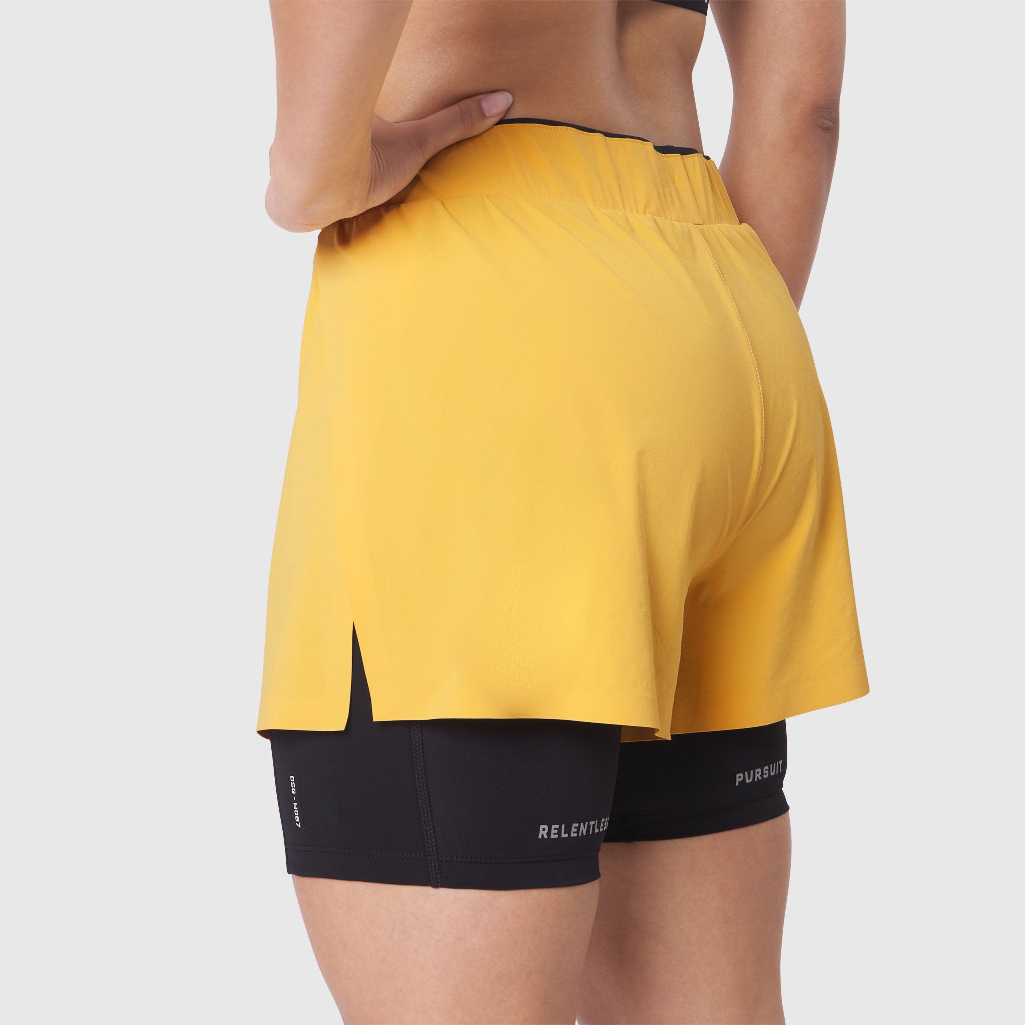 W087 Aerotex Side Split Liner Short in Amber, back view on model