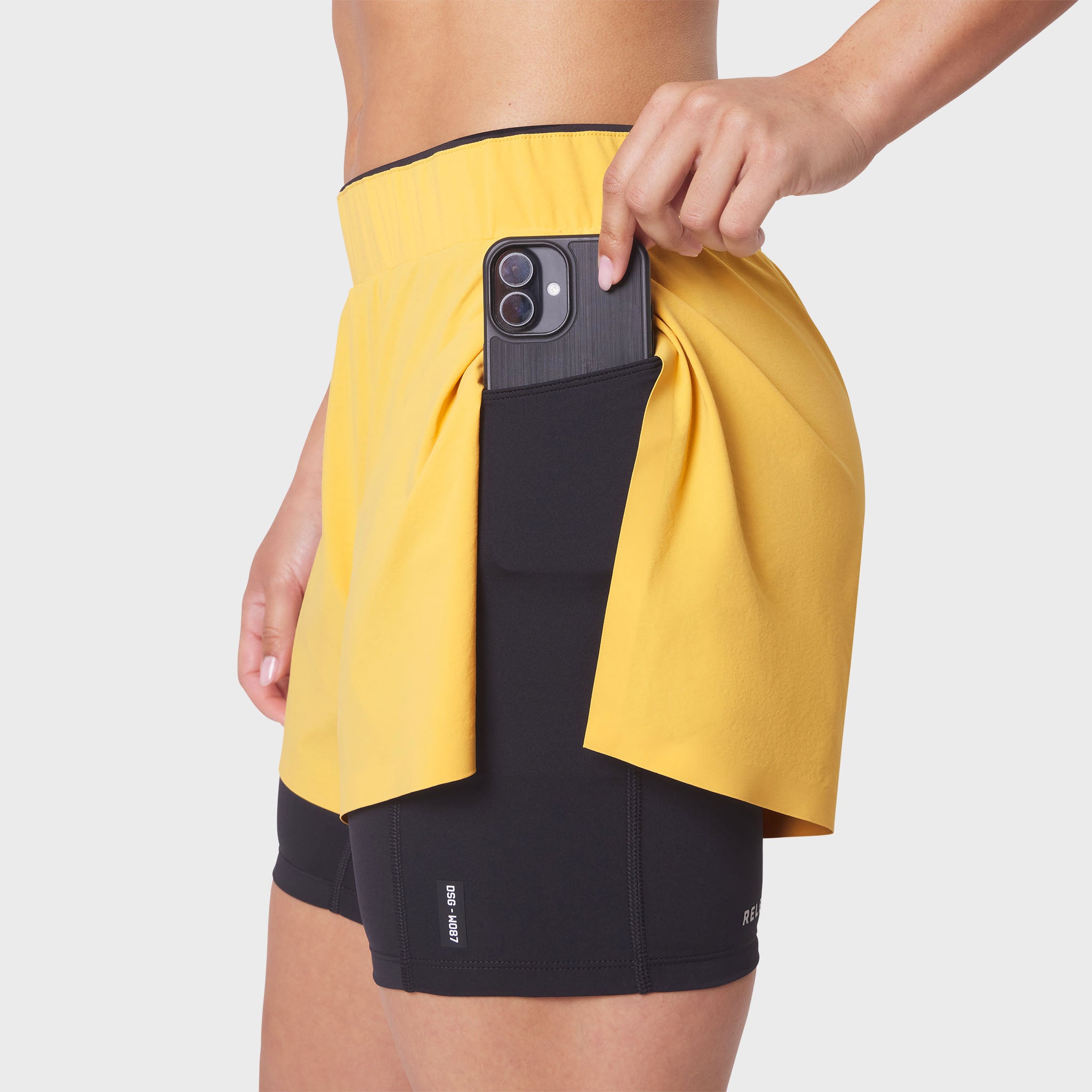 W087 Aerotex™ Side Split Liner Short in Amber, worn with phone in side pocket