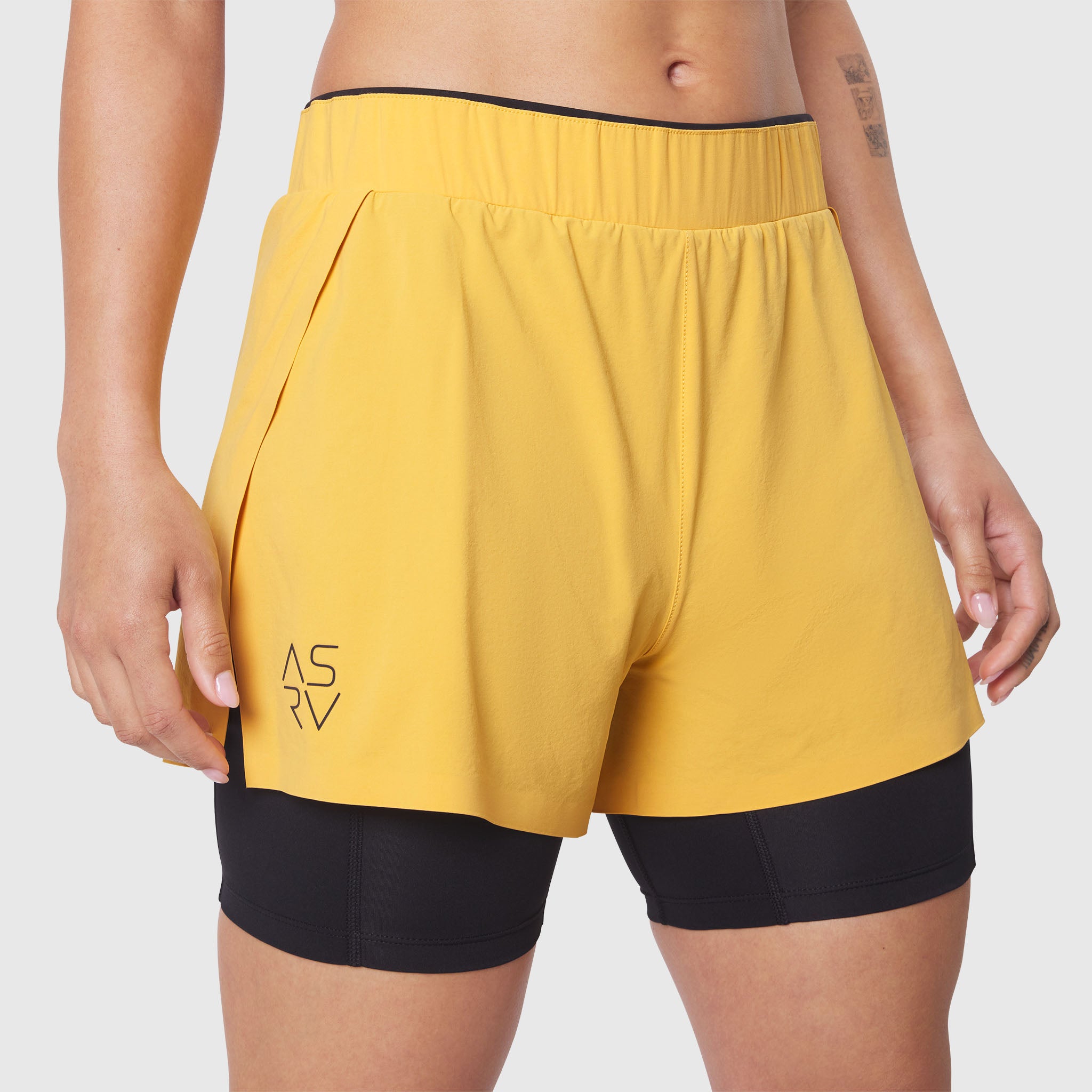 W087 Aerotex Side Split Liner Short in Amber, worn by model, front view