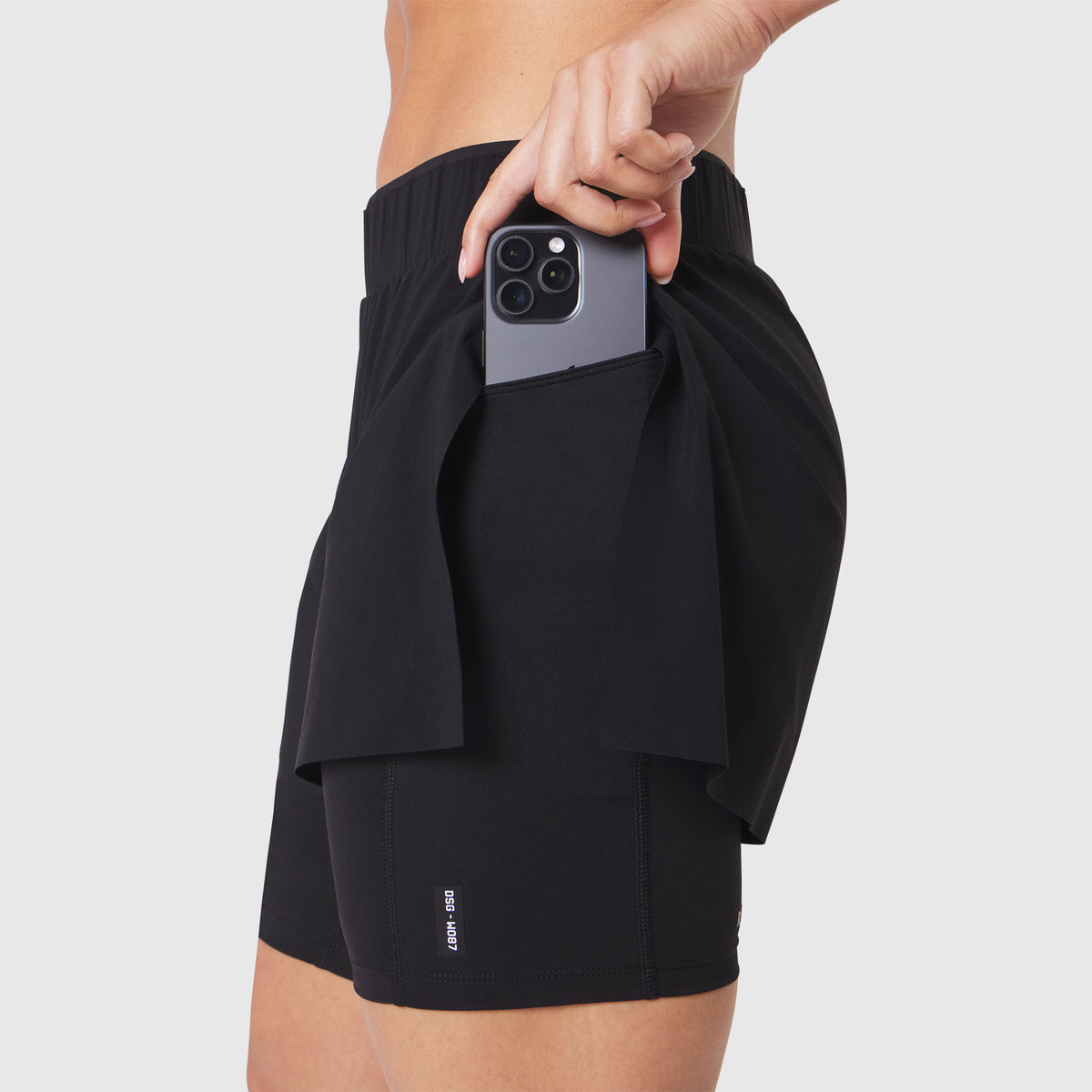 W087 Aerotex Side Split Liner Short in Black, worn with phone in pocket