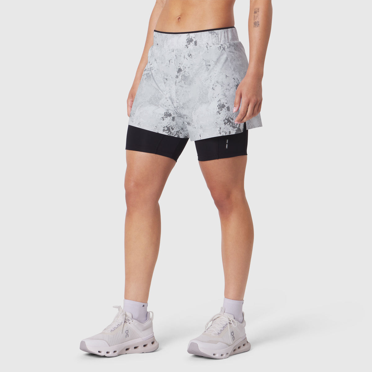 W087 Aerotex Side Split Liner Short in Sedona Snow Camo, front view on model