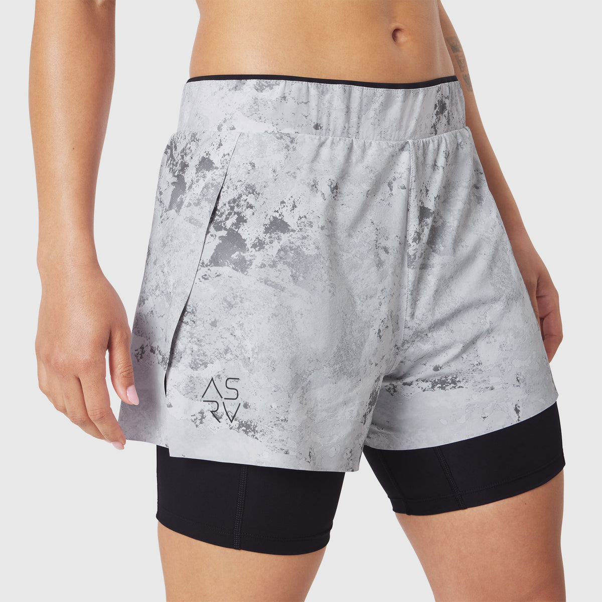 W087 Aerotex Side Split Liner Short in Sedona Snow Camo, worn by model, side view