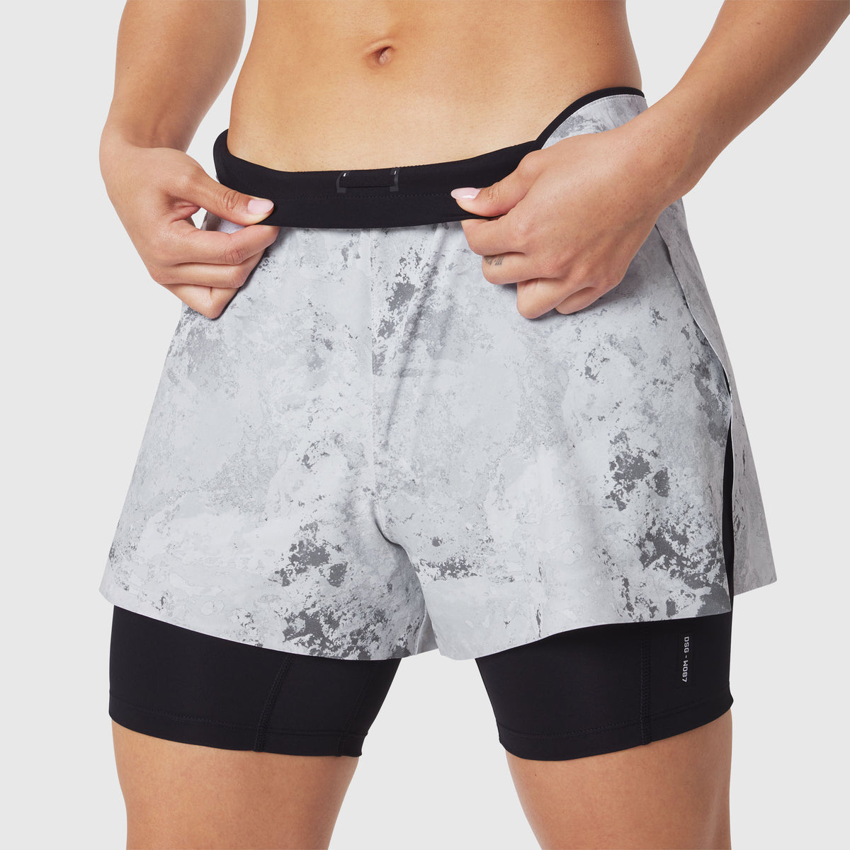 W087 Aerotex Side Split Liner Short in Sedona Snow Camo, worn by model