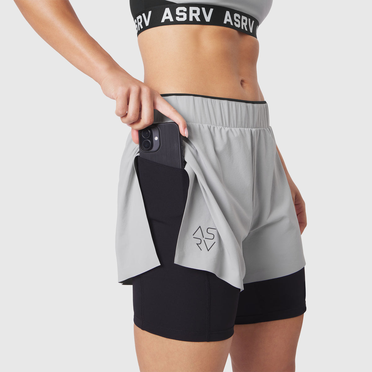 W087 Aerotex Side Split Liner Short in Slate Grey, worn by model showing phone pocket detail