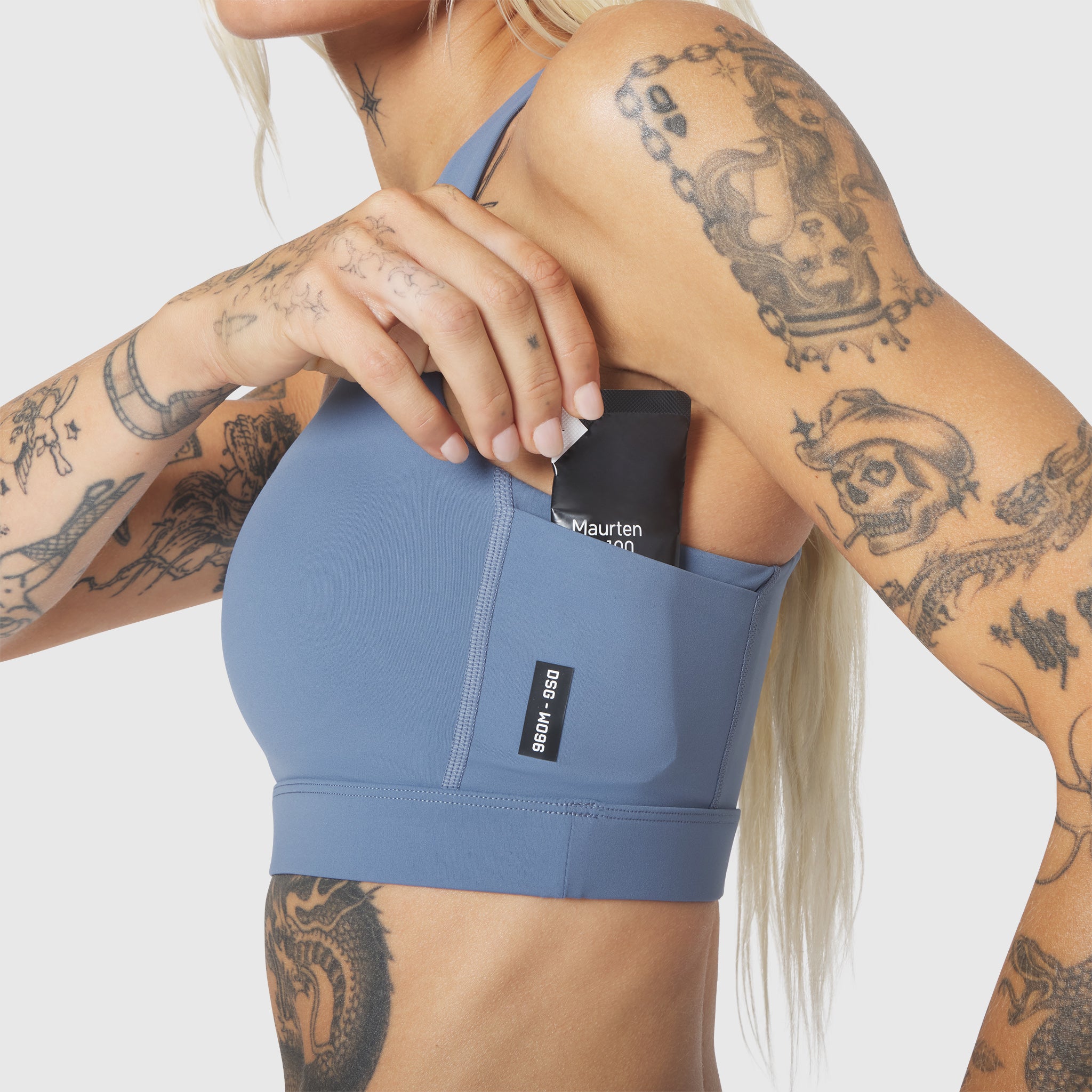 W096 LYCRA® ADAPTIV Racerback Sports Bra in Slate Blue, worn by model