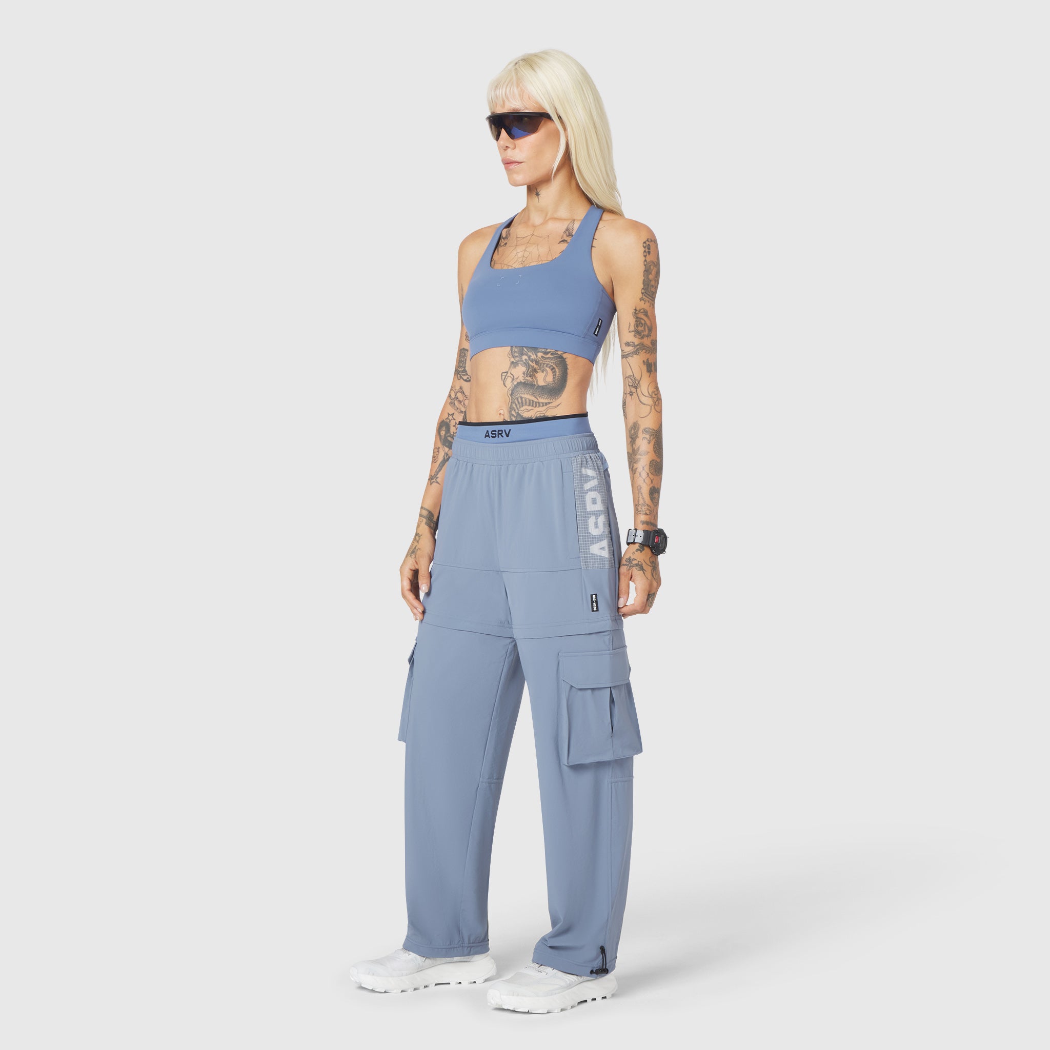 W096 LYCRA® ADAPTIV Racerback Sports Bra in Slate Blue, front view on model