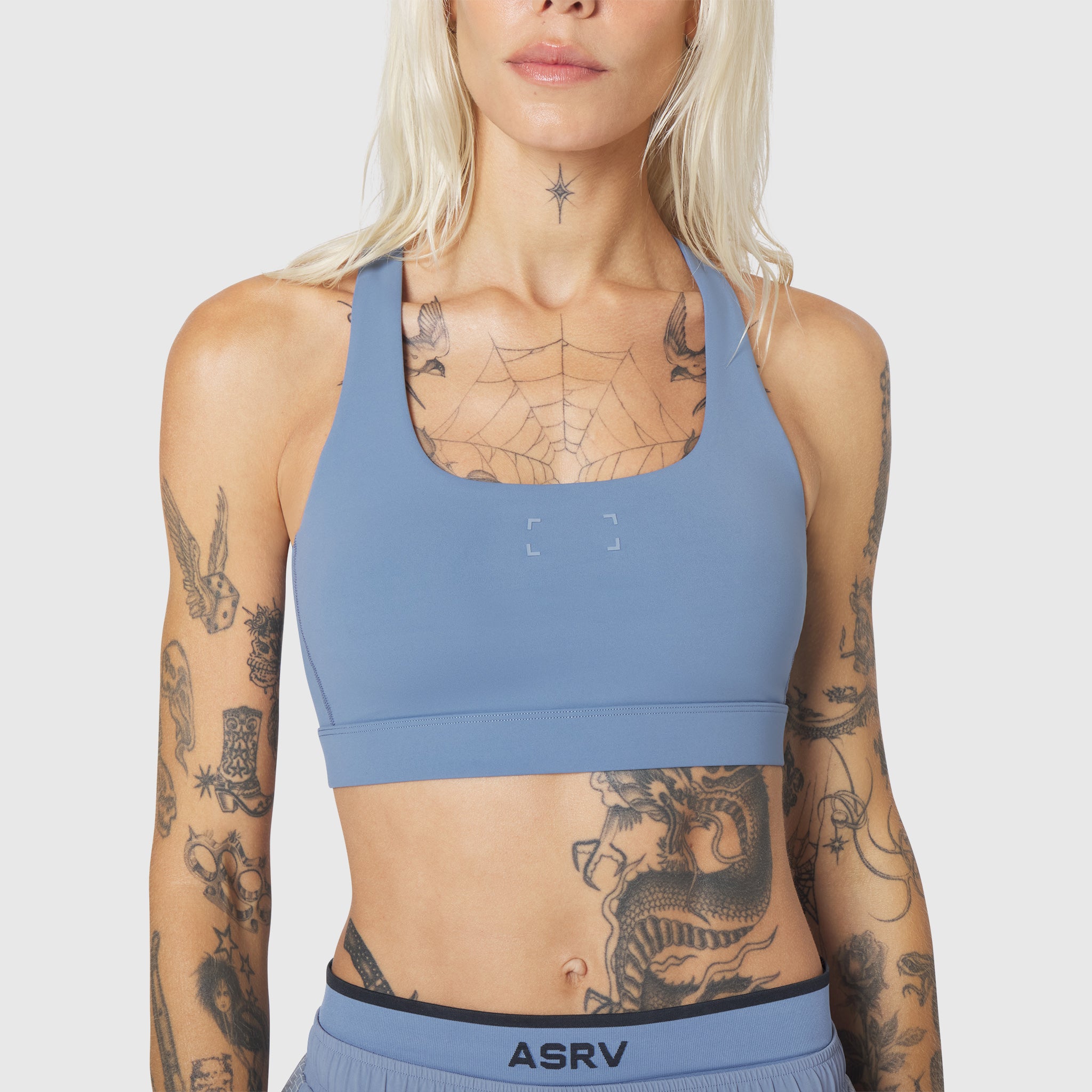 W096 LYCRA® ADAPTIV Racerback Sports Bra in Slate Blue, front view on model