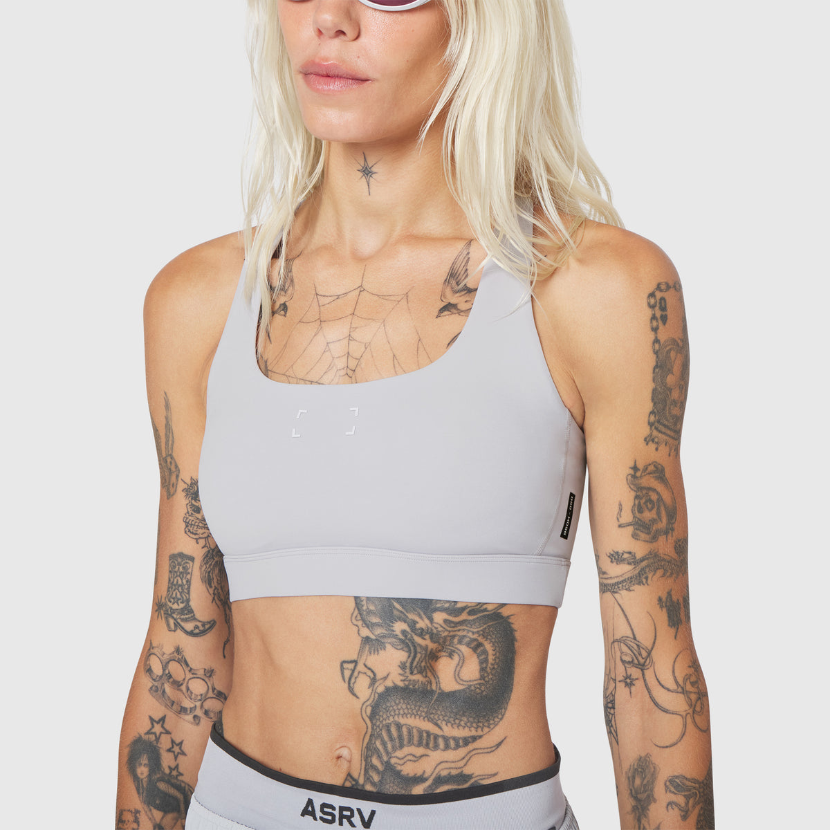 W096 LYCRA® ADAPTIV Racerback Sports Bra in Slate Grey, front view on model