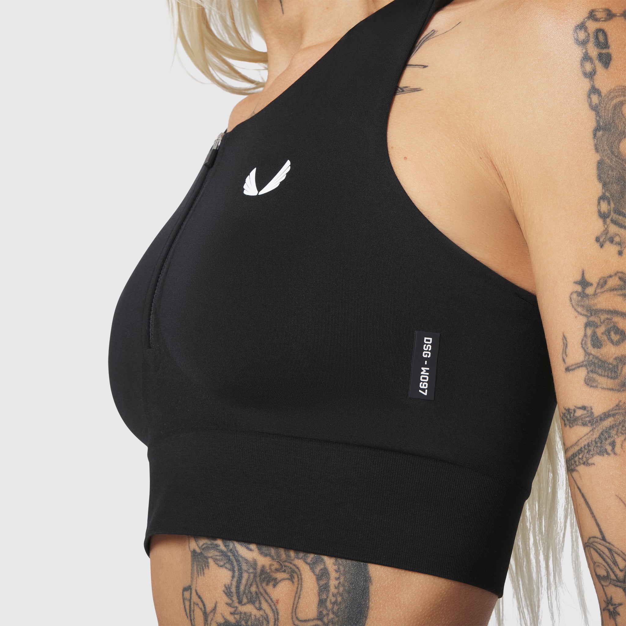 LYCRA® ADAPTIV Seamless Zip Bra in Black, side view on model