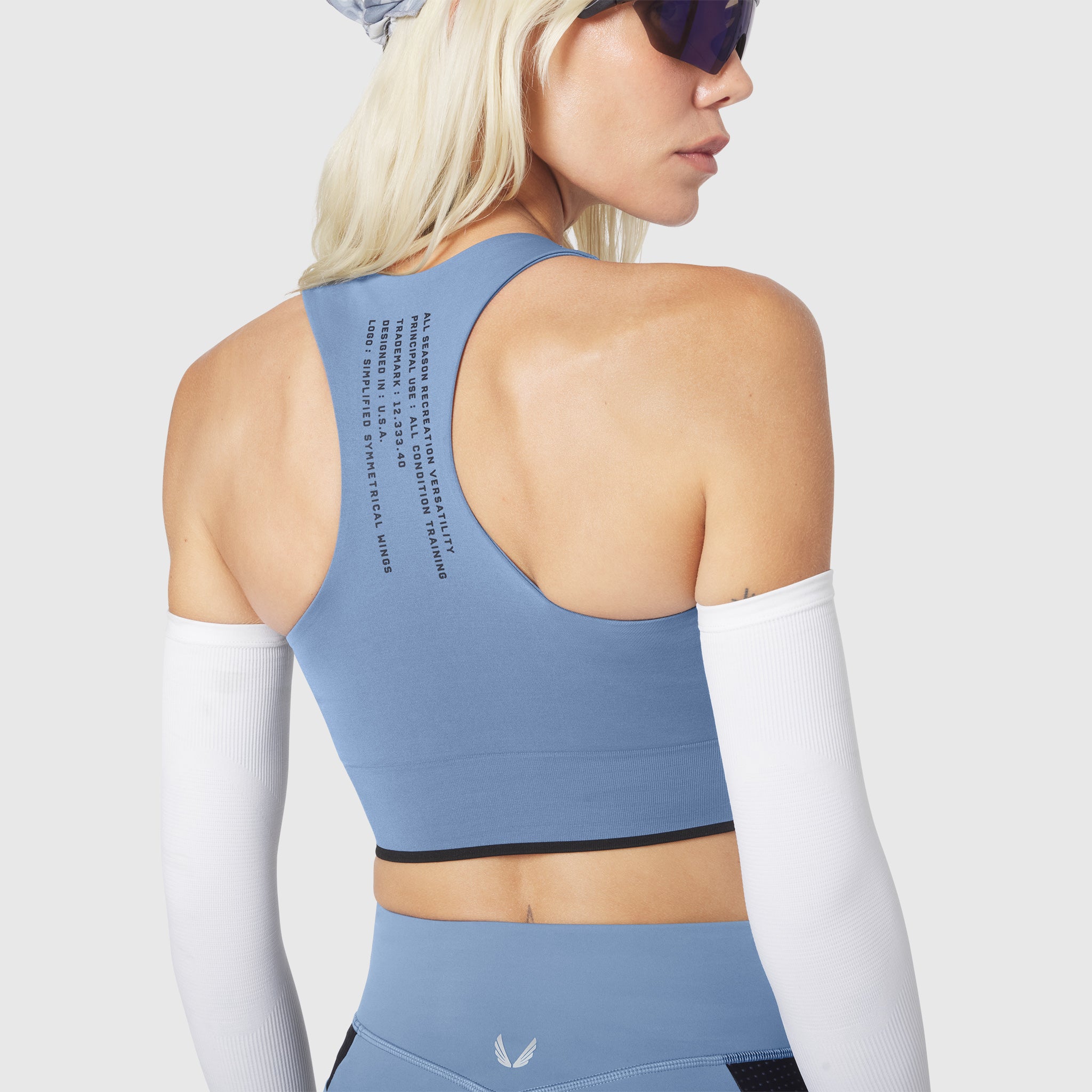 W097 LYCRA® ADAPTIV Seamless Zip Bra in Slate Blue, back view on model