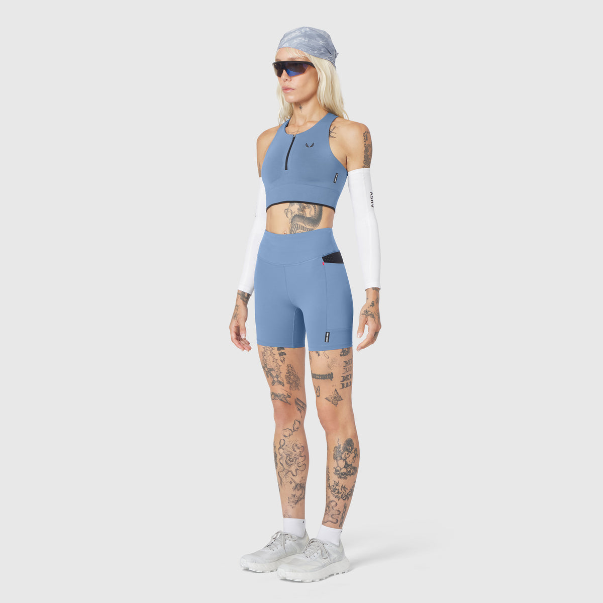 W097 LYCRA® ADAPTIV Seamless Zip Bra in slate blue, worn by model, front view