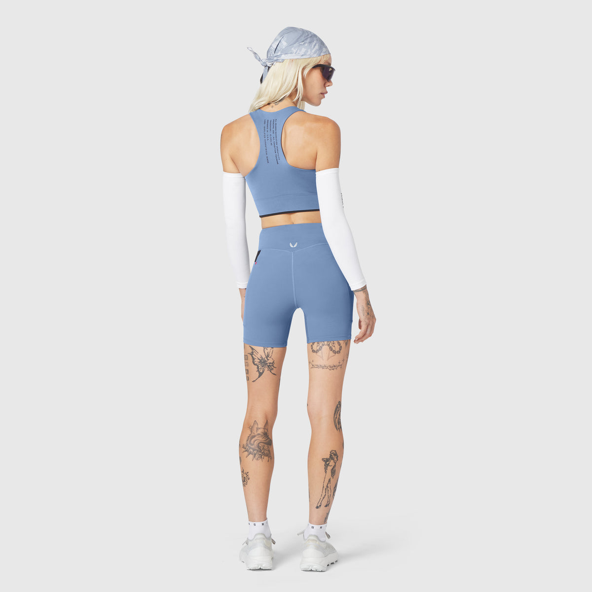 W097 LYCRA® ADAPTIV Seamless Zip Bra in Slate Blue, back view on model
