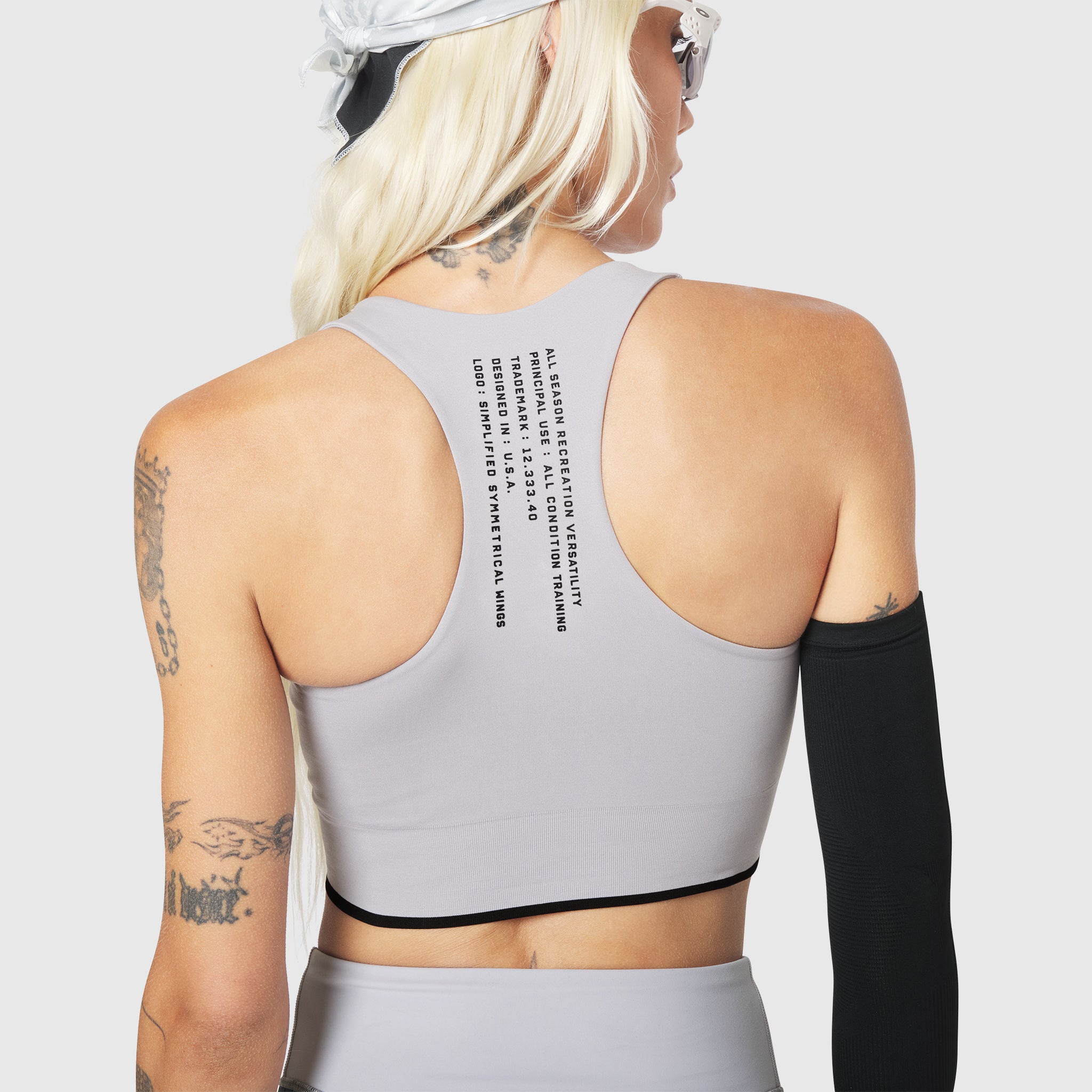 W097 LYCRA® ADAPTIV Seamless Zip Bra in Slate Grey, back view on model