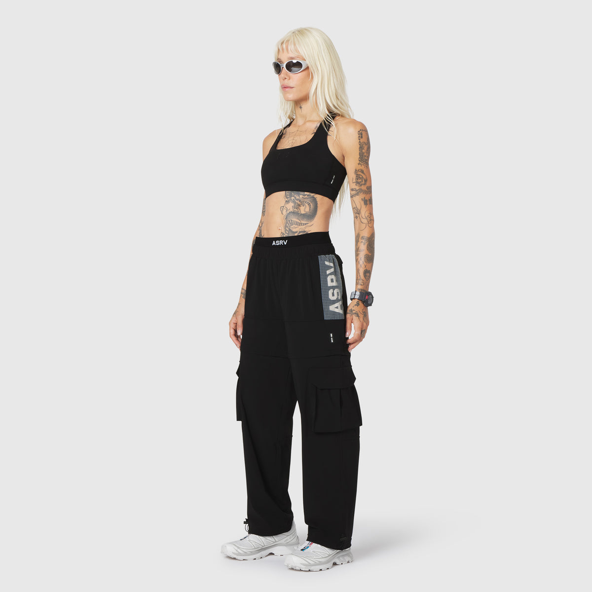 W100 2-in-1 Convertible Pant in black, worn by model standing against neutral background