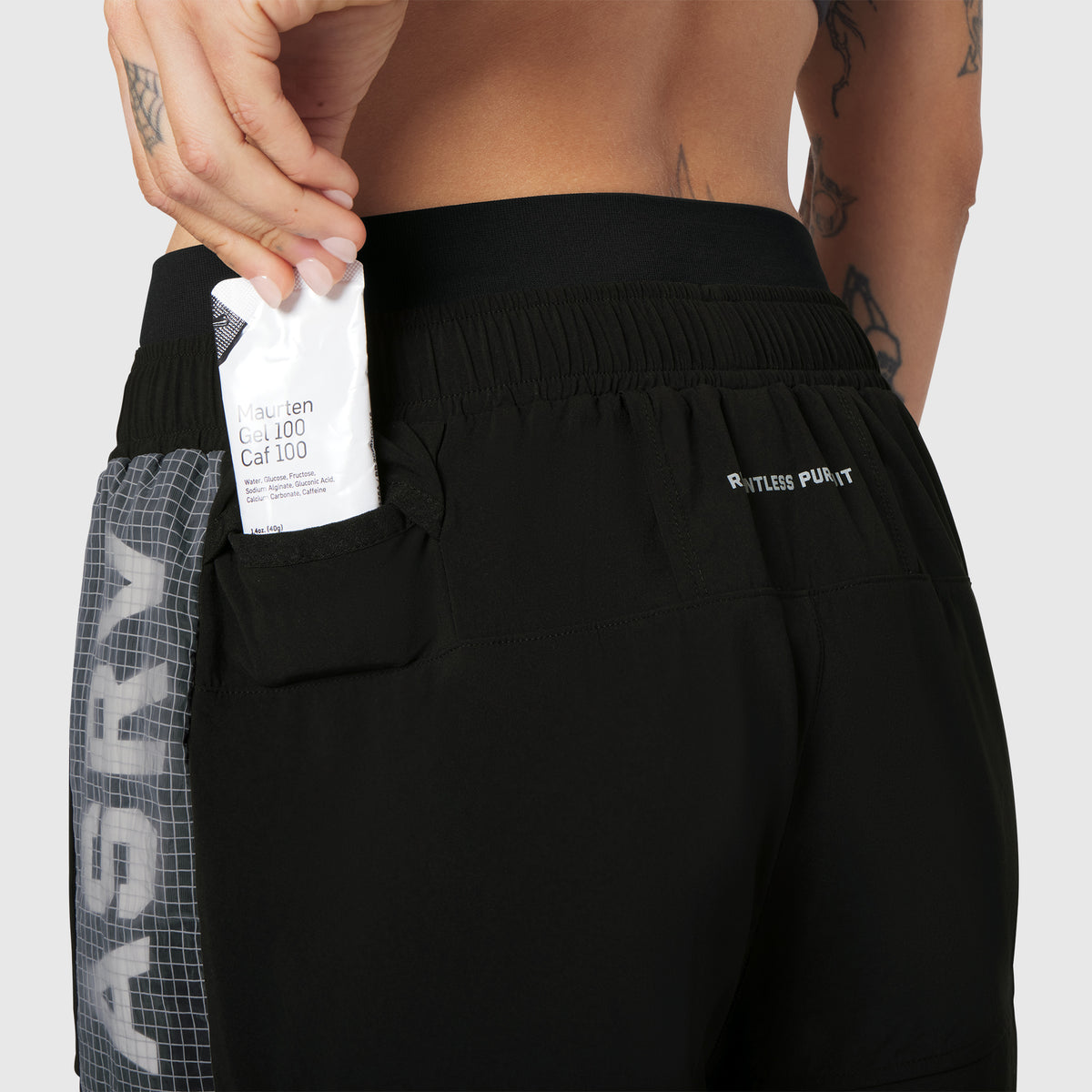 W100 2-in-1 Convertible Pant in black, worn with pocket detail shown
