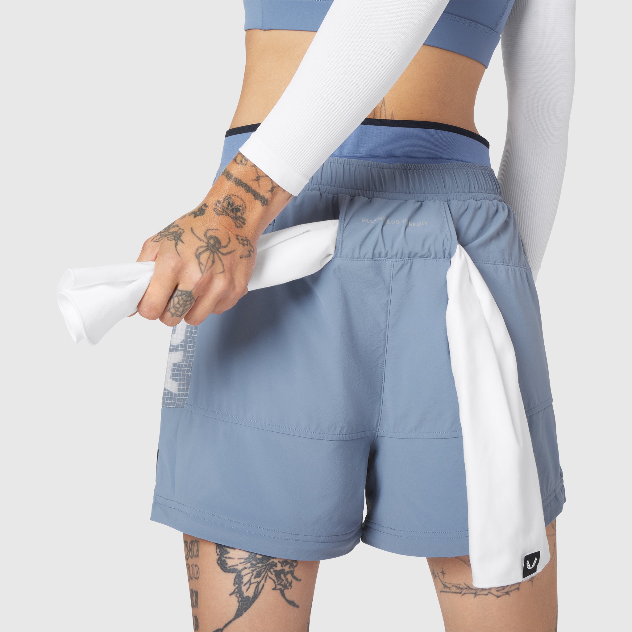 W100 2-in-1 Convertible Pant in Slate Blue, worn by model showing detachable shorts