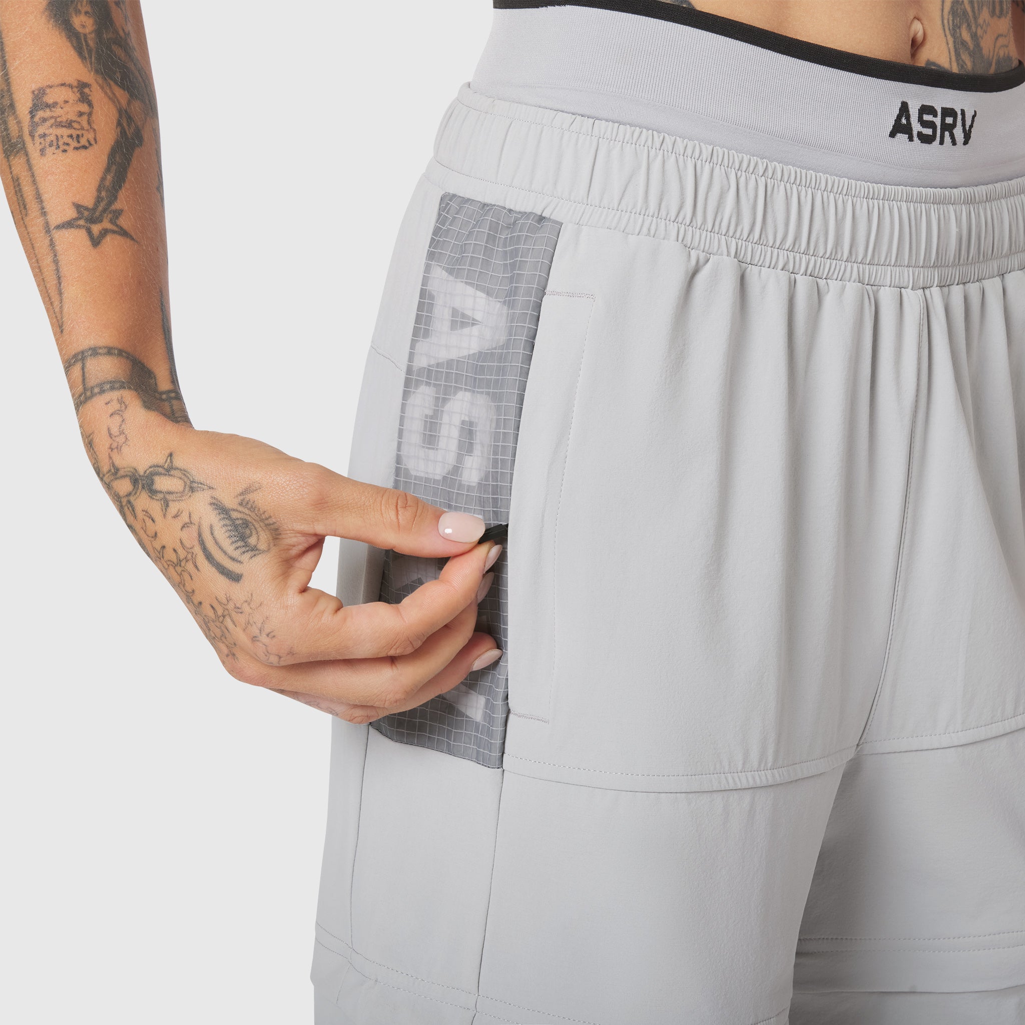 W100 2-in-1 Convertible Pant in Slate Grey, front pocket detail with model