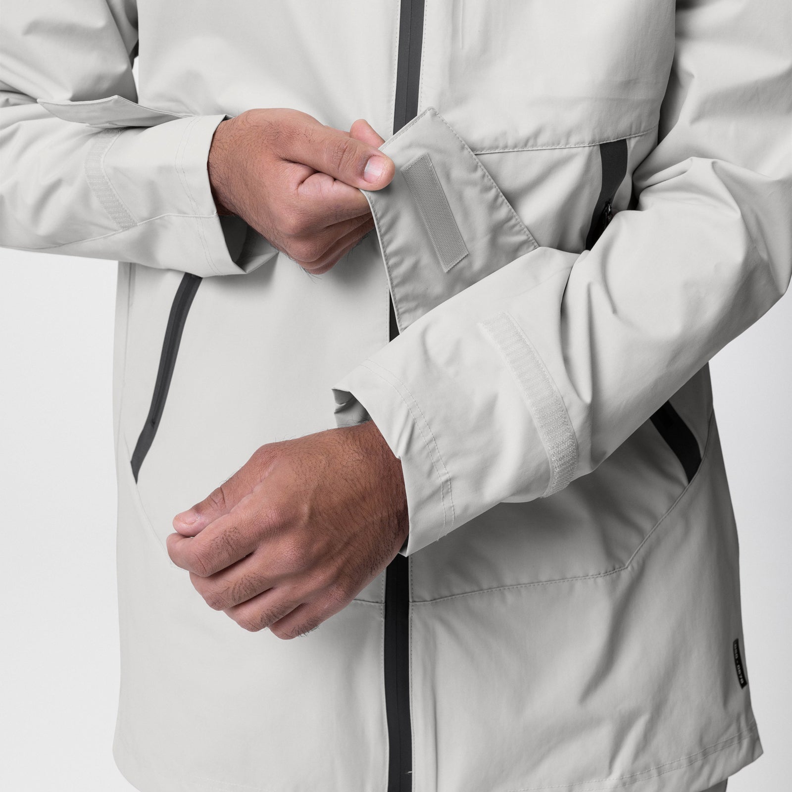 Hipora® Tech Parka in stone, worn by model showing sleeve and zipper detail