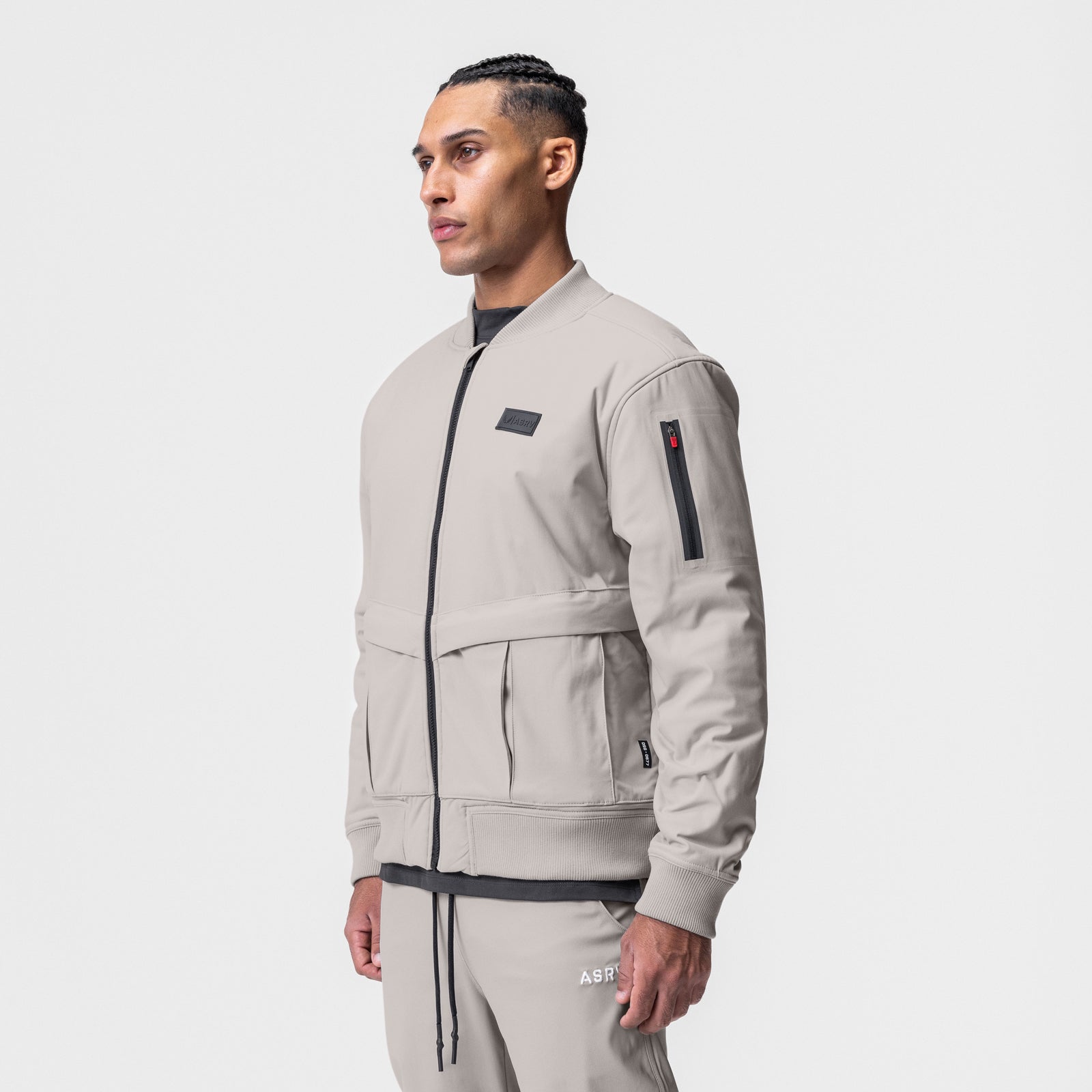 Kinterra Weatherproof Bomber Jacket in chai, worn by model in side profile