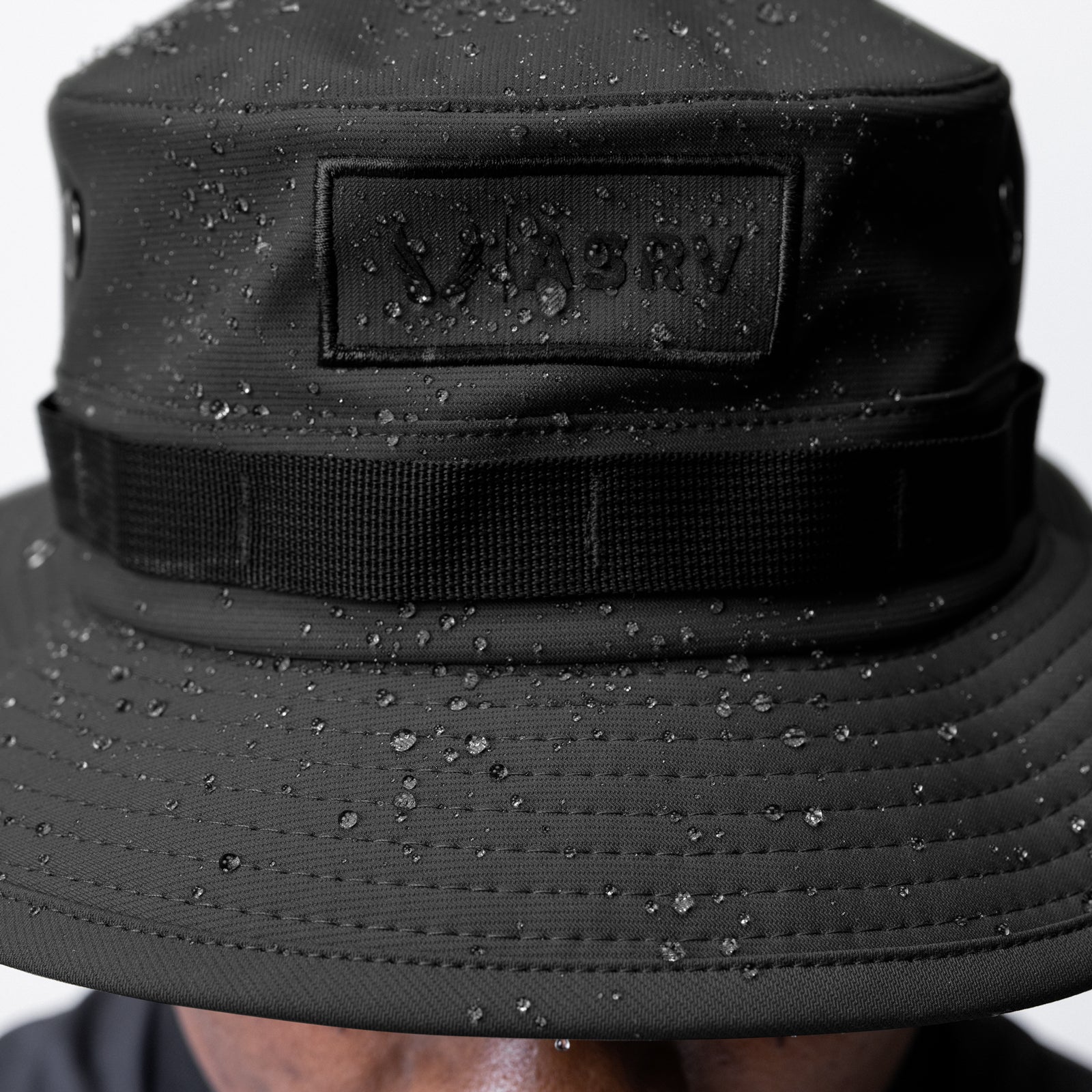 Waterproof Vented Boonie Hat in black, worn on model