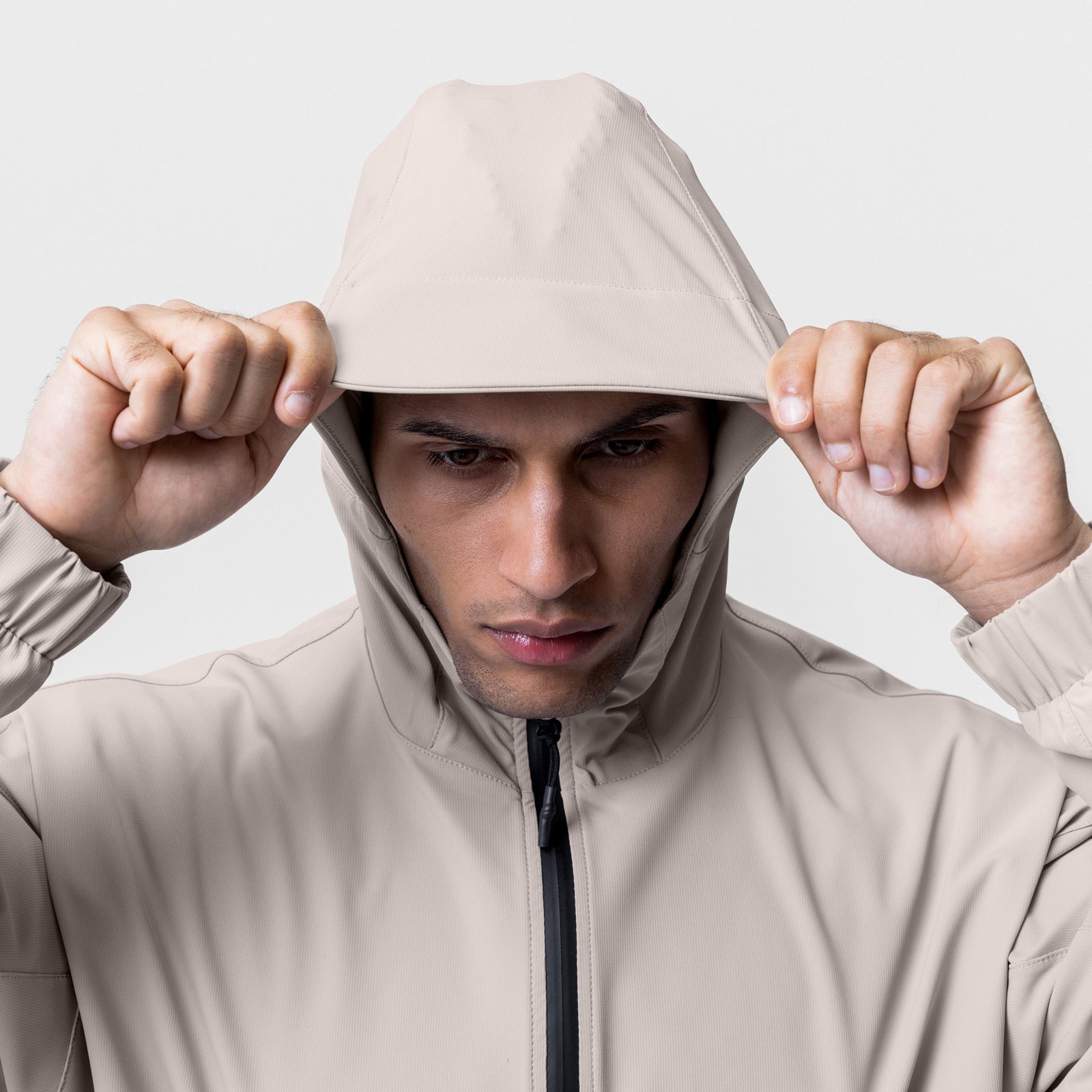 Weather-Ready Anorak Jacket in Chai worn by model pulling hood down, front view