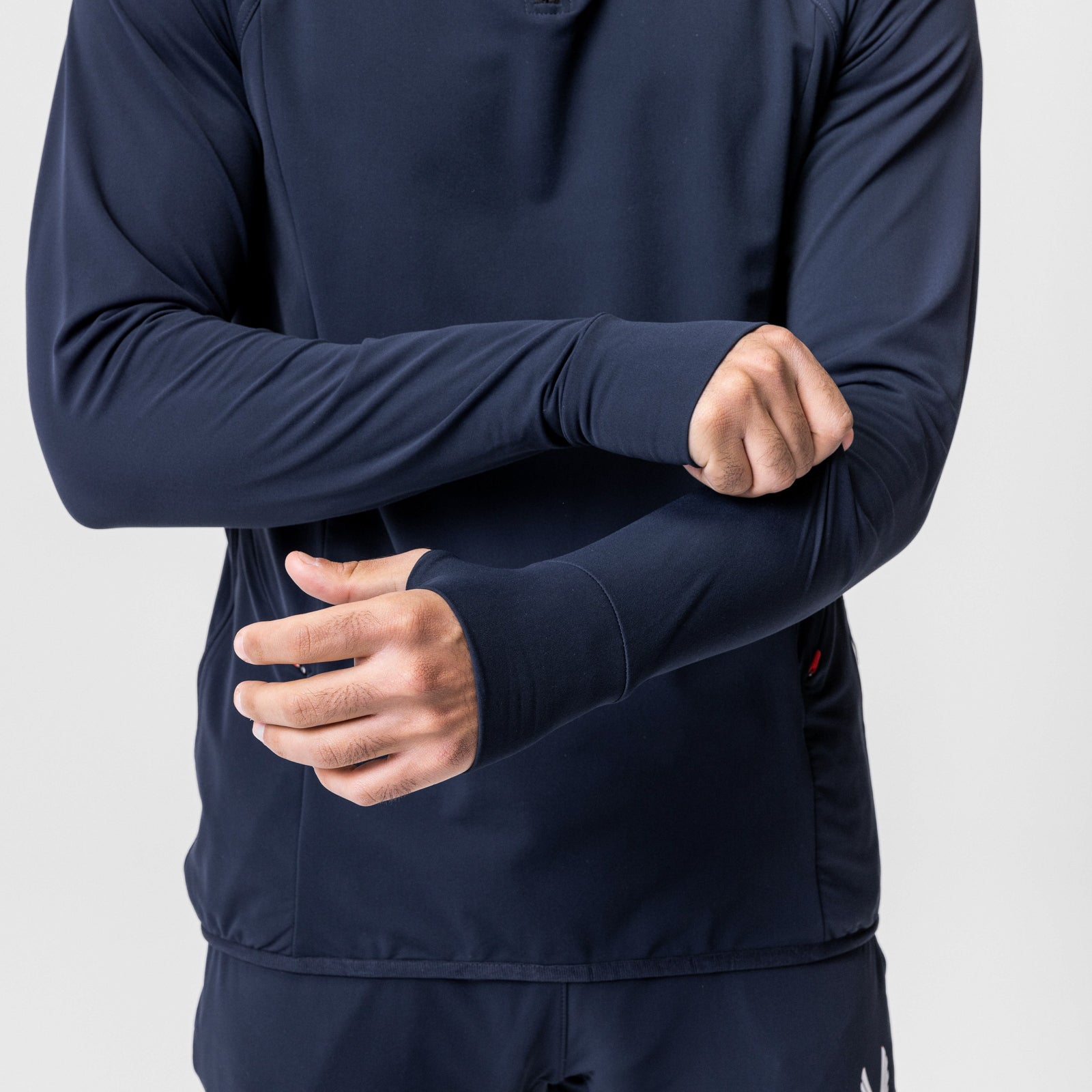 Navy training hoodie worn by model with arms crossed, front view
