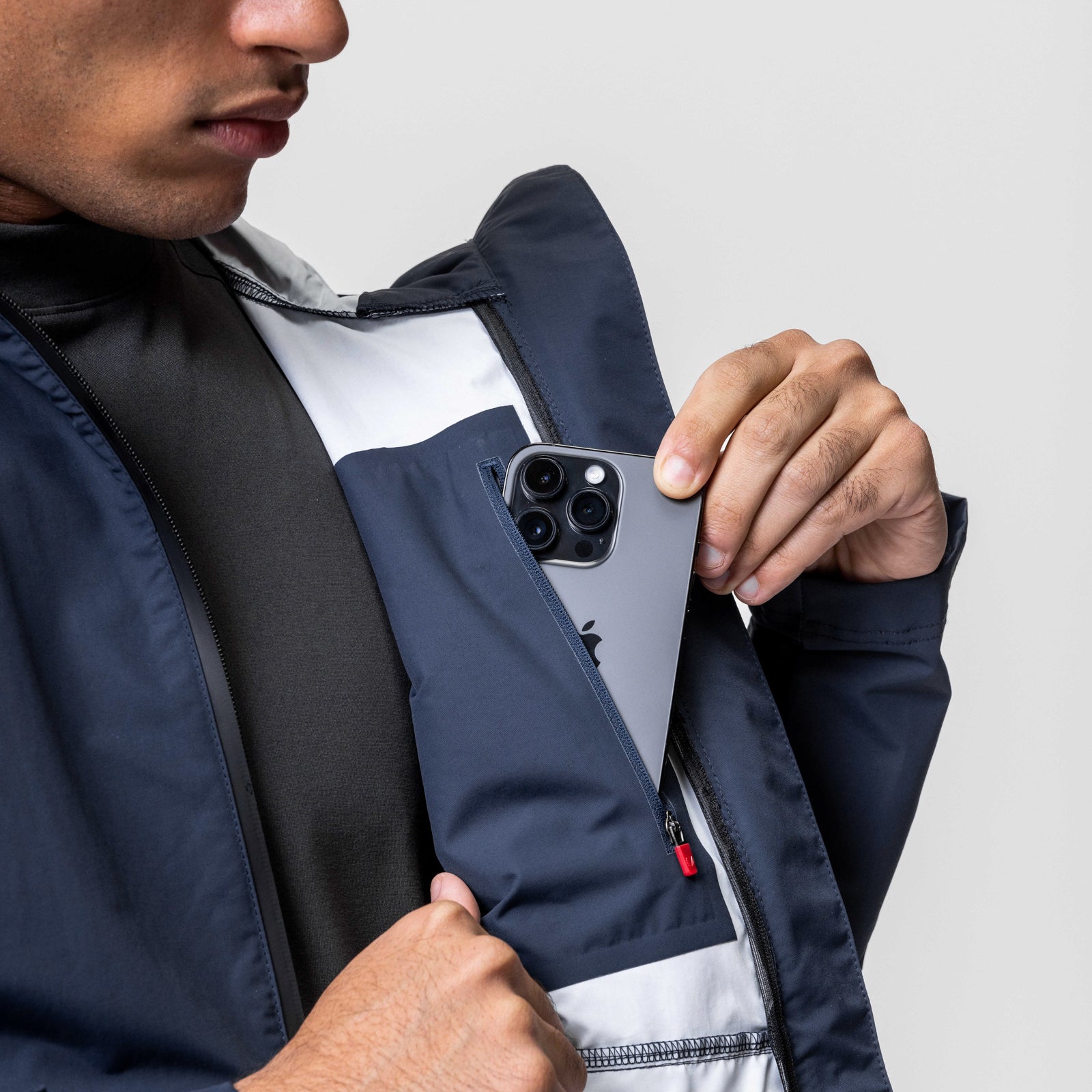 Navy Hipora® Tech Parka worn by model, showing open jacket with interior detail