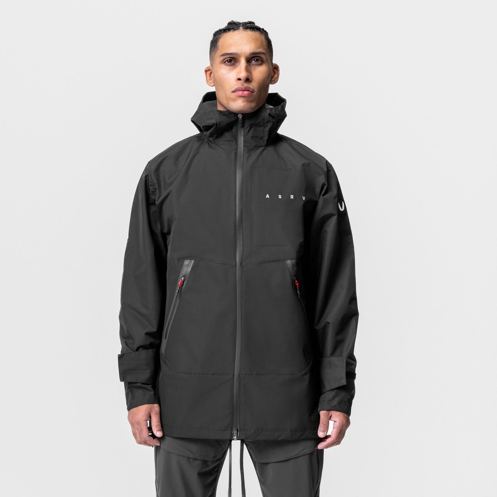 Black Hipora® Tech Parka worn by model, front view with hood up