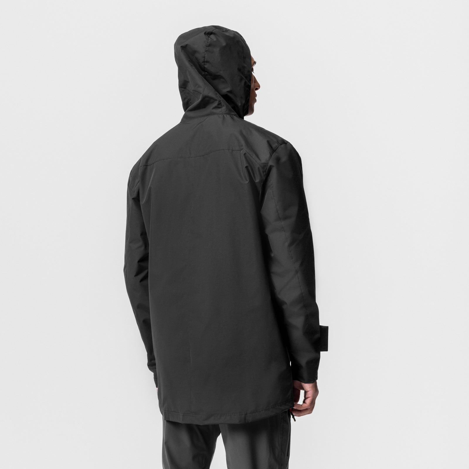 Black Hipora® Tech Parka worn by model, rear view