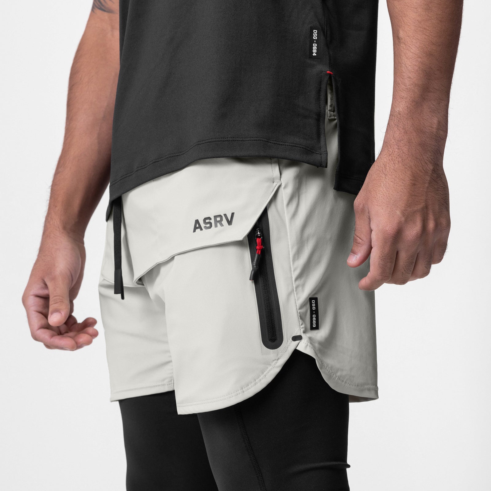 Tetra-Lite Tech Short in stone, worn by model showing side pockets and design details