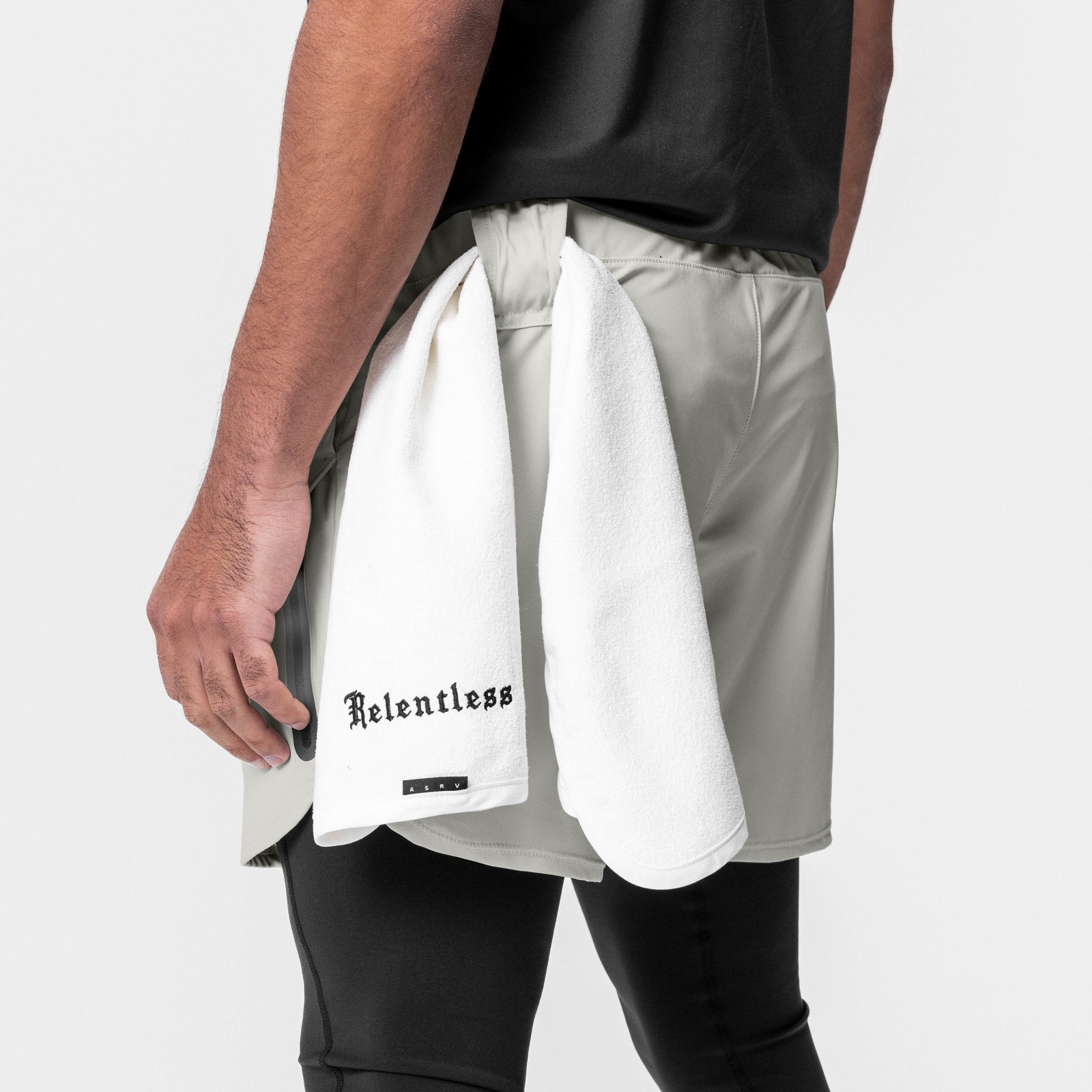 Tetra-Lite Tech Short in Stone, worn with white towel, side view