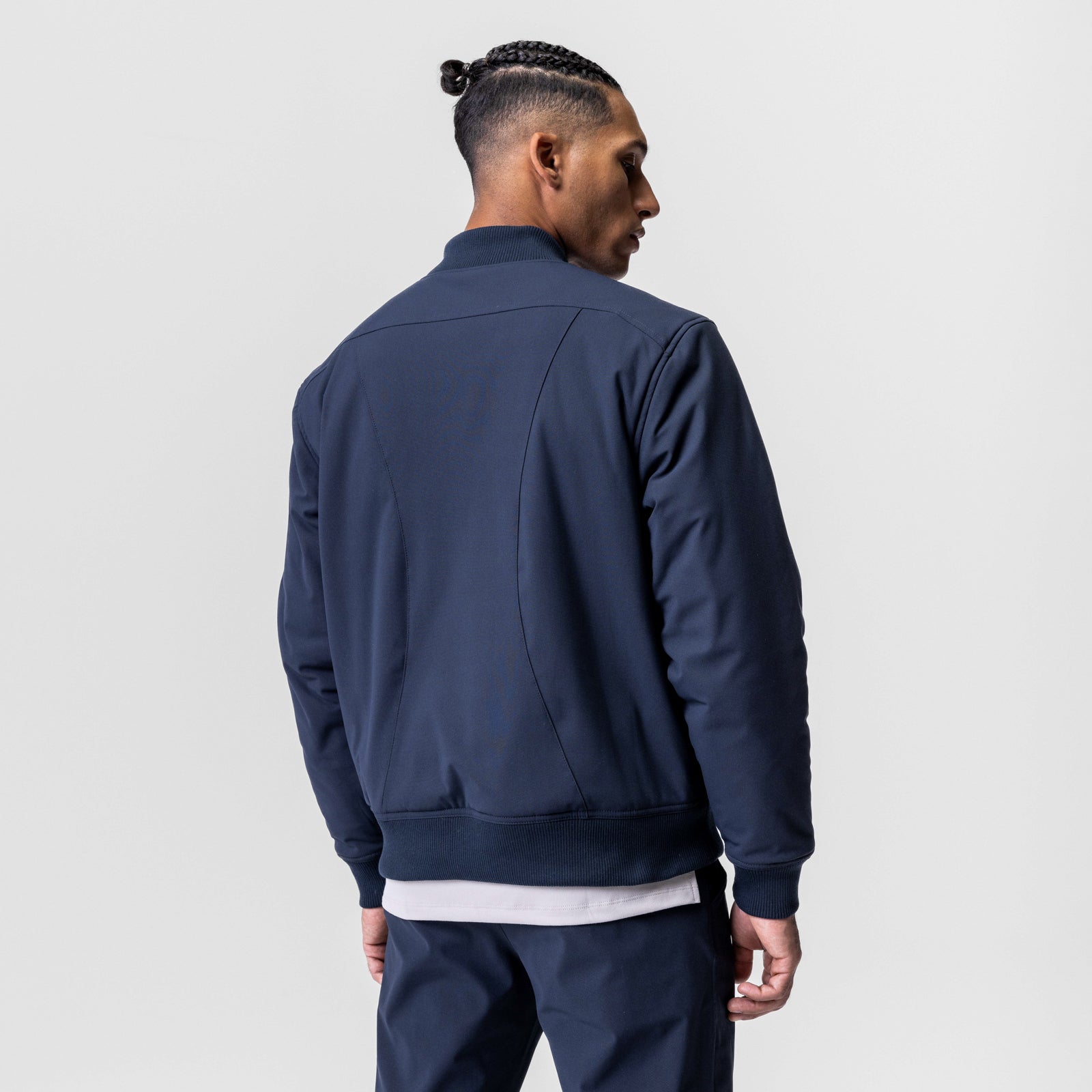 Kinterra Weatherproof Bomber Jacket in navy, worn by model shown from back