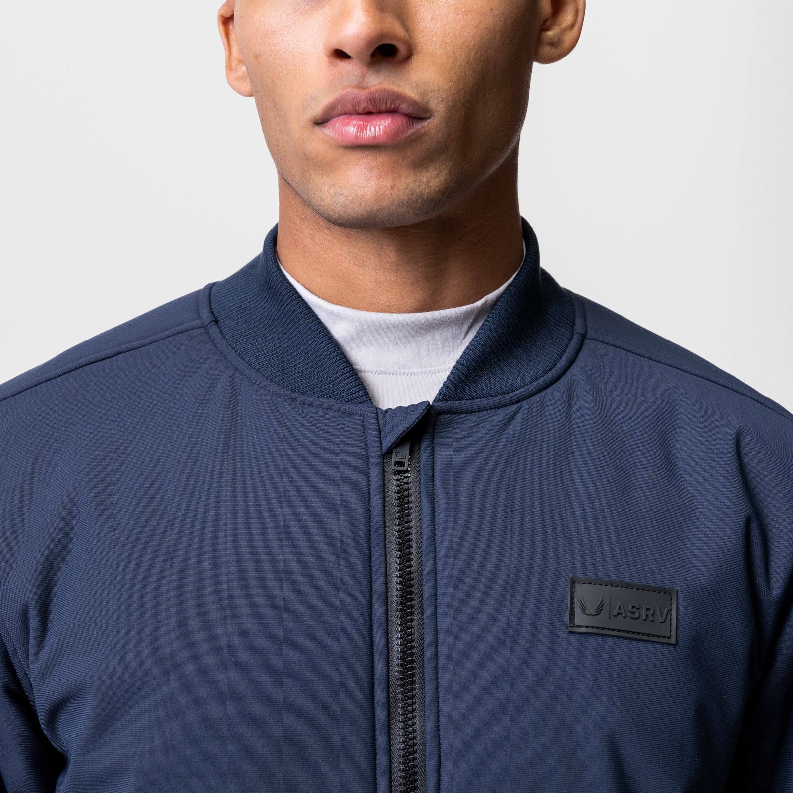 Kinterra Weatherproof Bomber Jacket in navy worn by model, front view