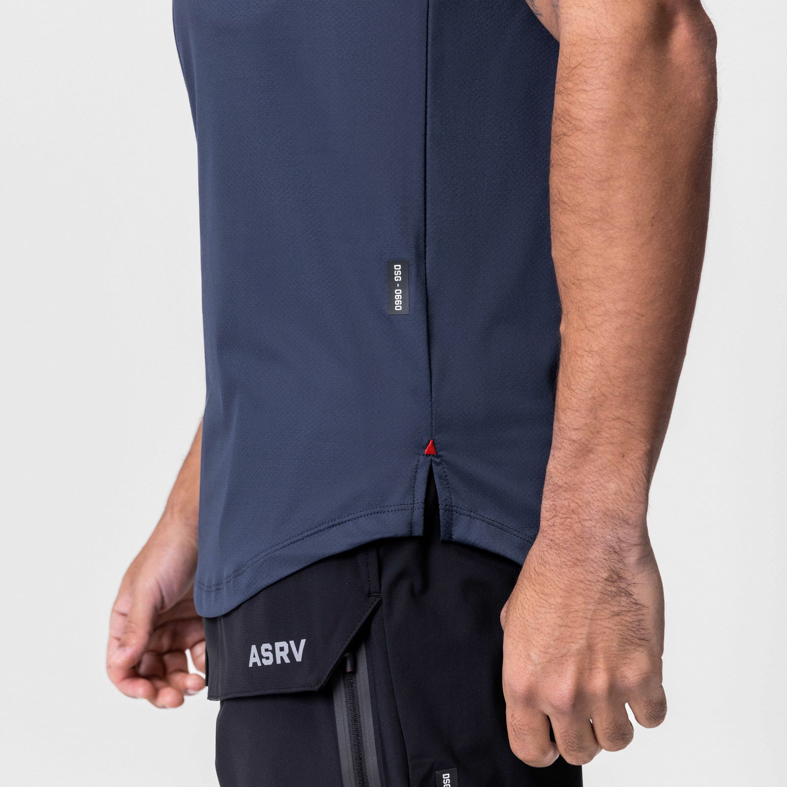 AeroSilver Established Tee in navy worn by model, side detail view showing box logo