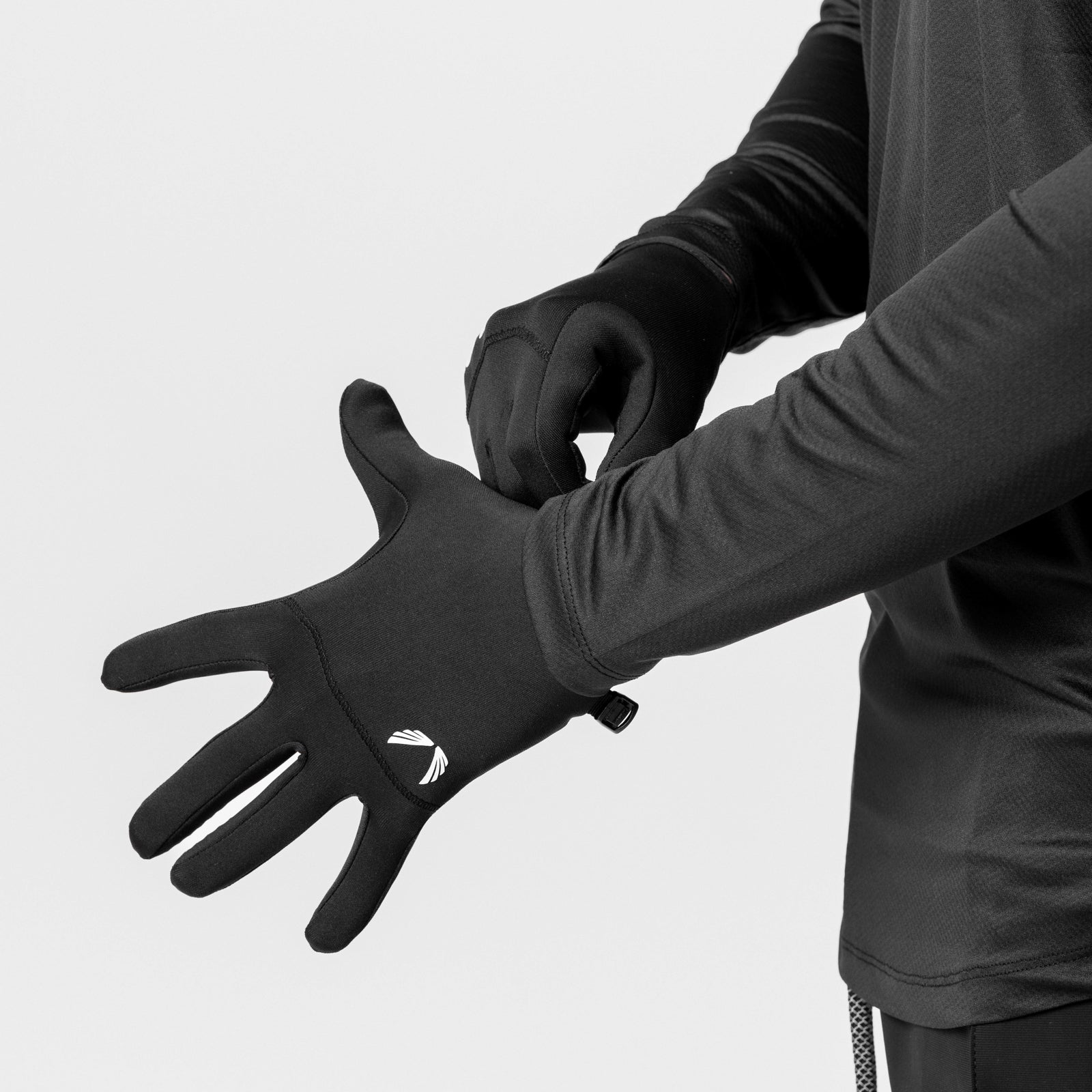 Aeroheat Lightweight Gloves in black, worn on model's hands in overhead shot